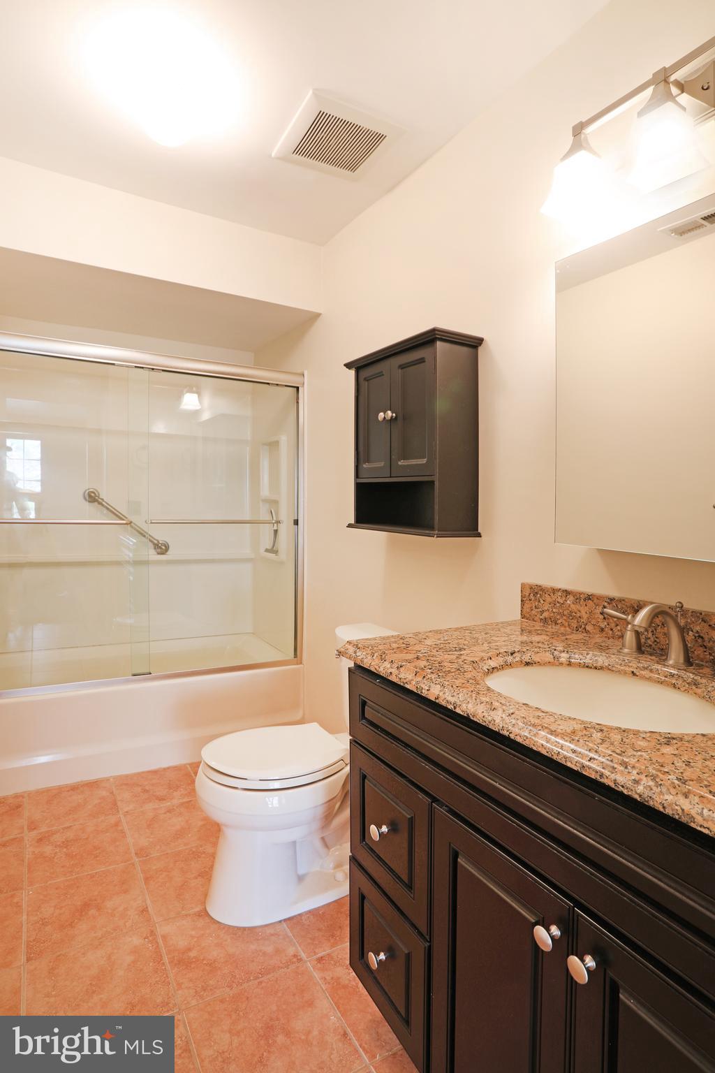 19 Chelsea Court Sewell, NJ 08080 - Photo 14 of 19 a bathroom with a granite countertop toilet sink and mirror