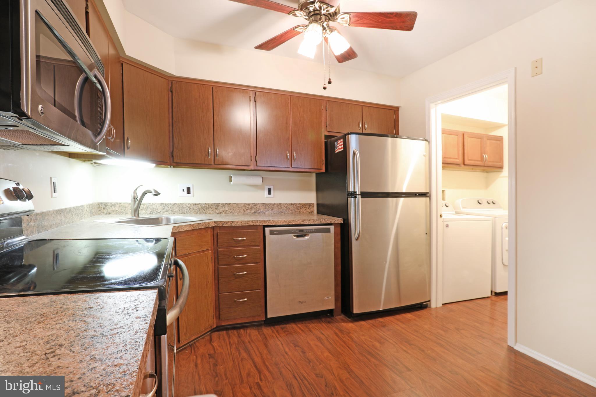 19 Chelsea Court Sewell, NJ 08080 - Photo 8 of 19 a kitchen with stainless steel appliances granite countertop a refrigerator a stove a sink and a microwave
