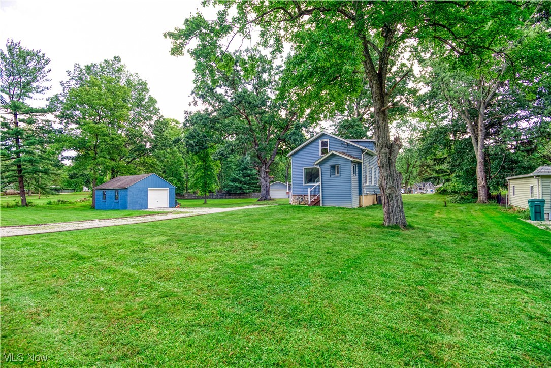 4051 Stow Road Stow, OH 44224 - Photo 29 of 38 View of yard featuring the home and a garage