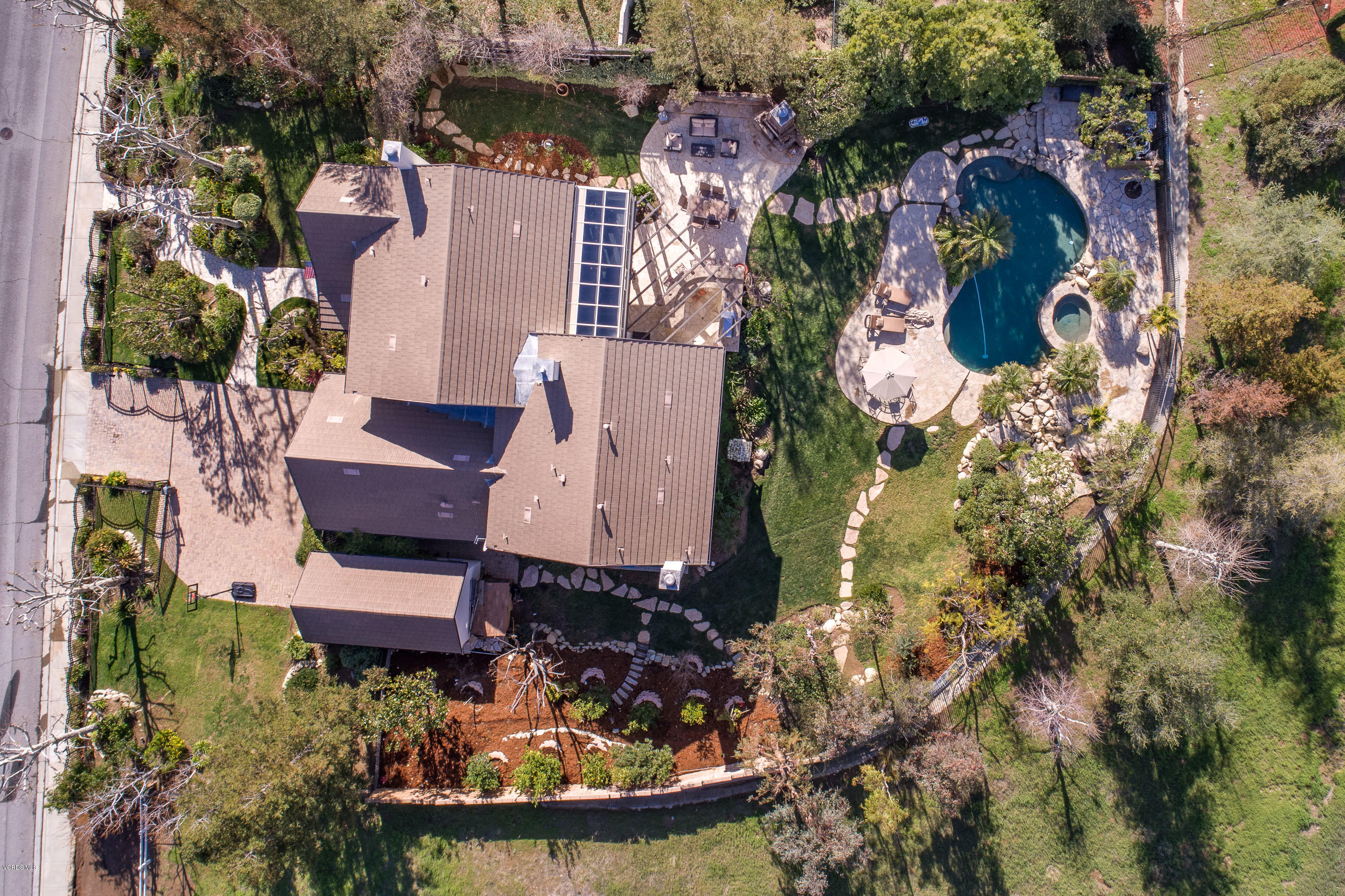 5635 Evening Sky Drive Simi Valley, CA 93063 - Photo 2 of 84 an aerial view of a house with a yard and lake view