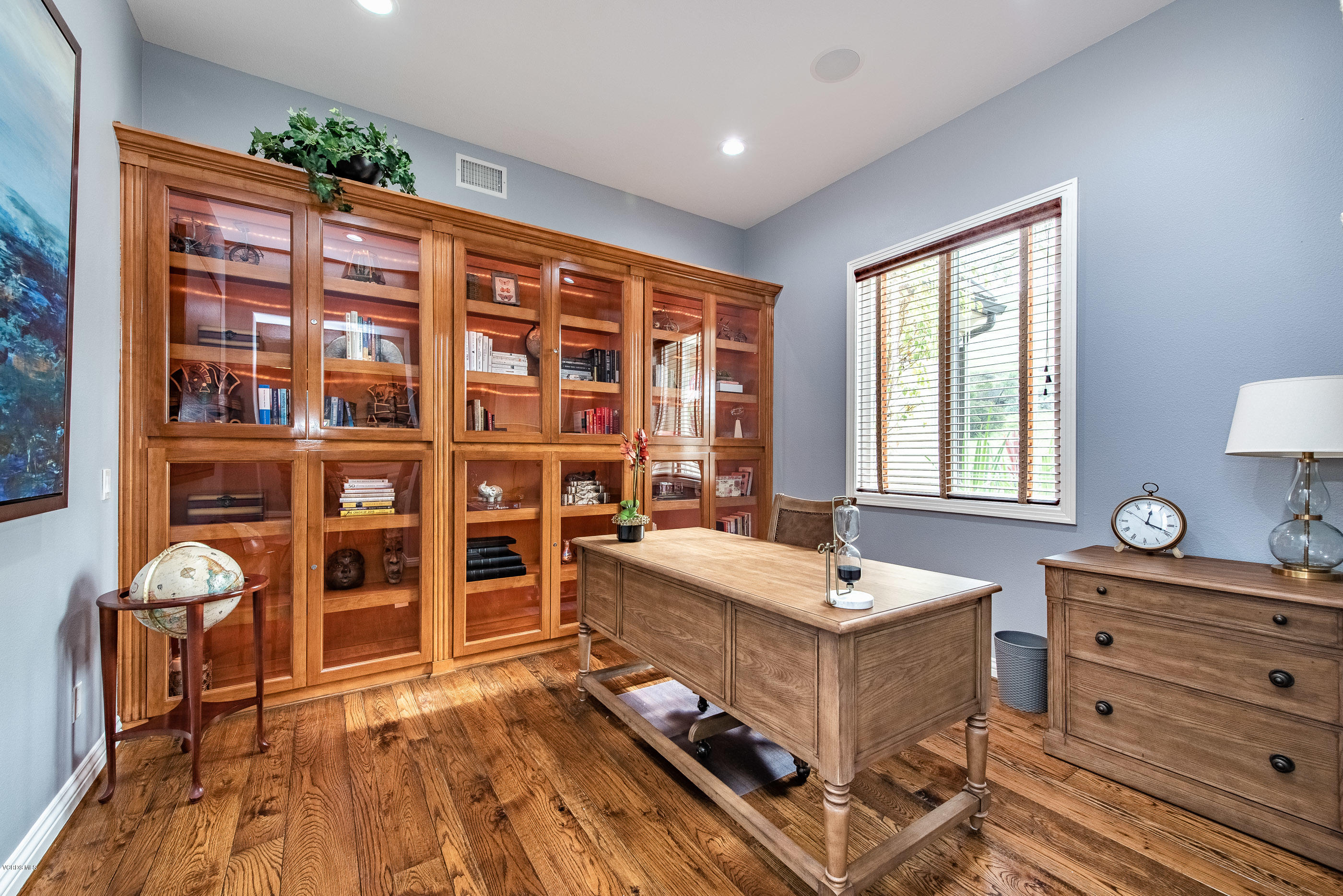 5635 Evening Sky Drive Simi Valley, CA 93063 - Photo 18 of 84 a living room with furniture and a bookshelf