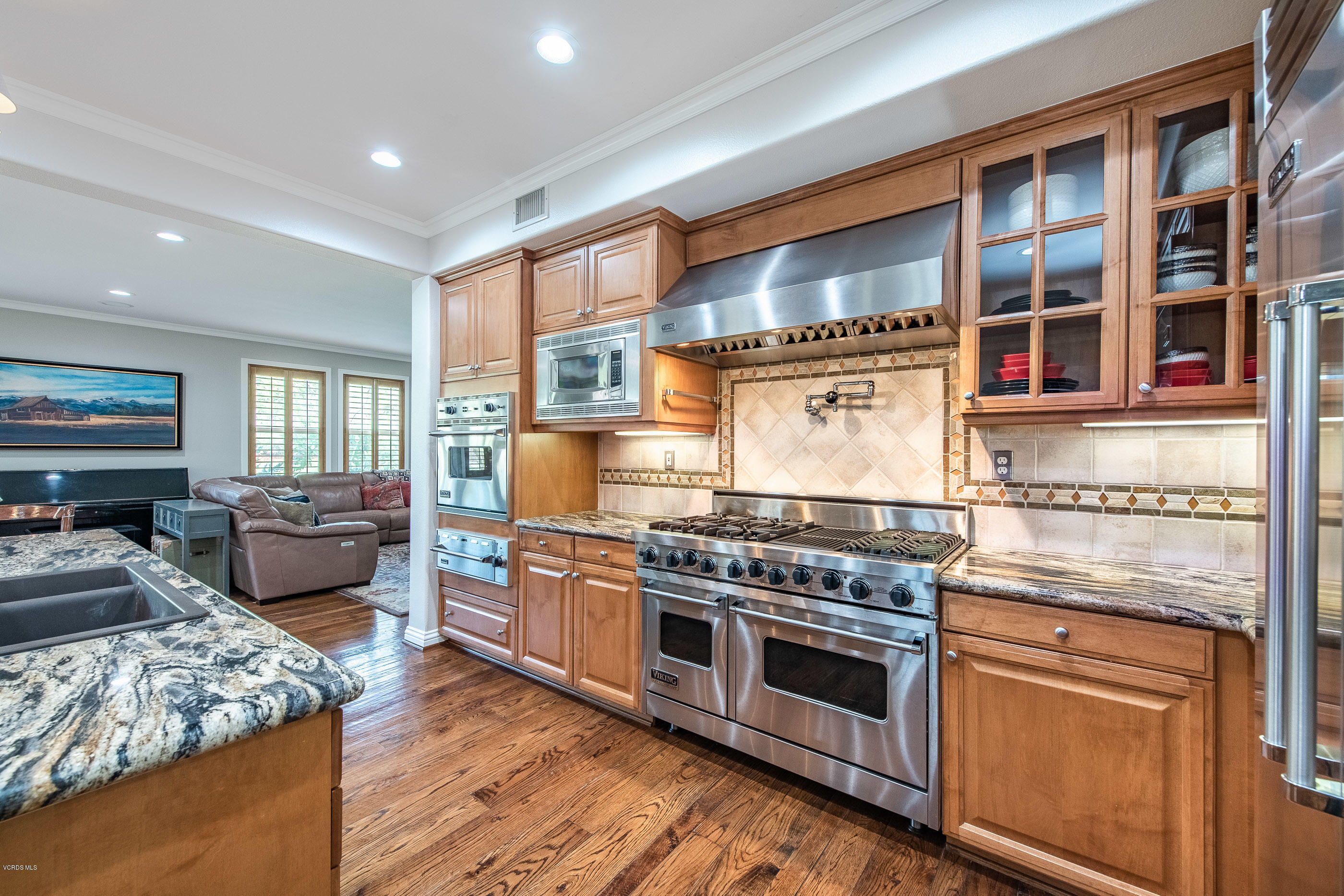 5635 Evening Sky Drive Simi Valley, CA 93063 - Photo 23 of 84 a kitchen with stainless steel appliances granite countertop a stove and a refrigerator