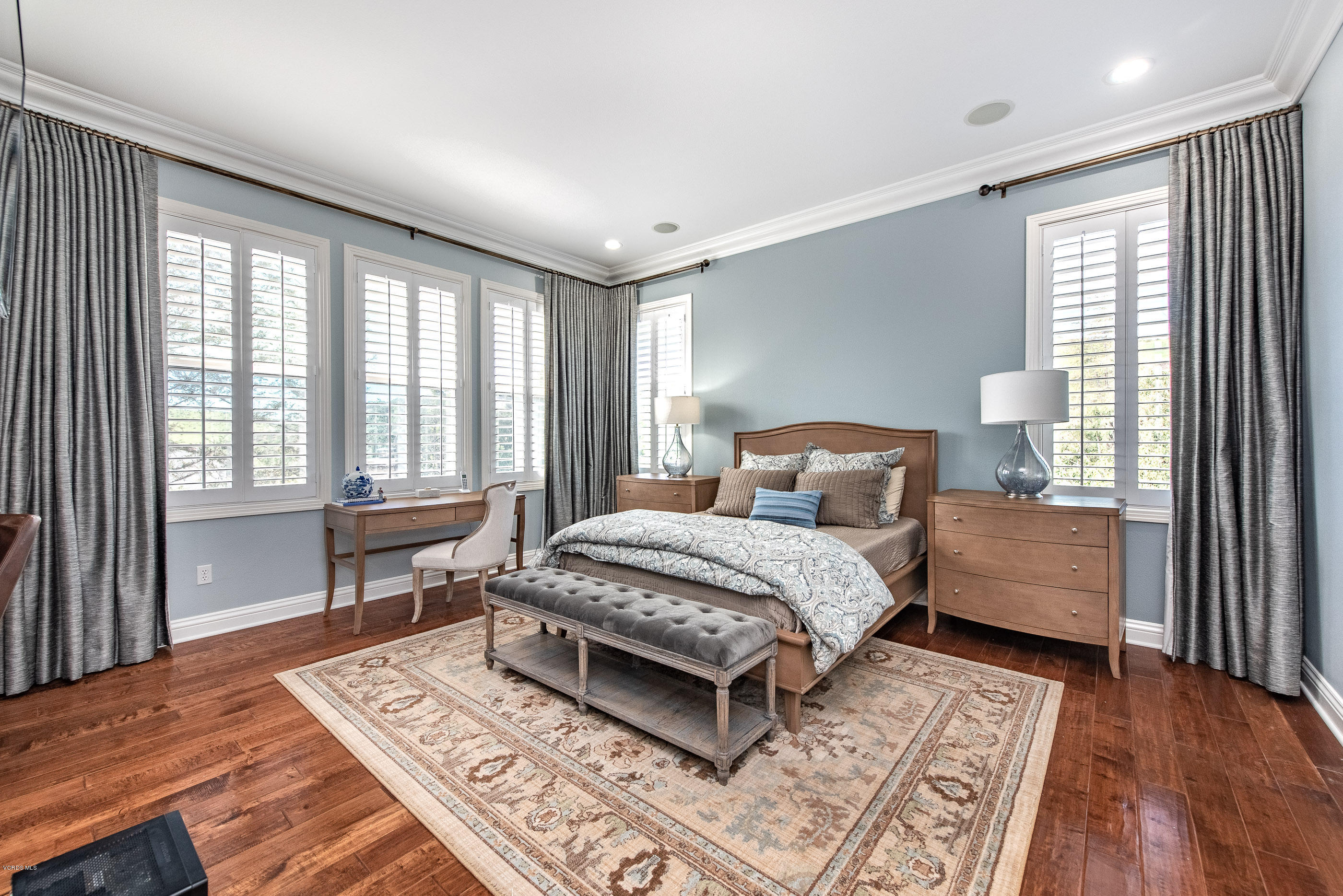 5635 Evening Sky Drive Simi Valley, CA 93063 - Photo 38 of 84 a bedroom with a bed wooden floor and a window