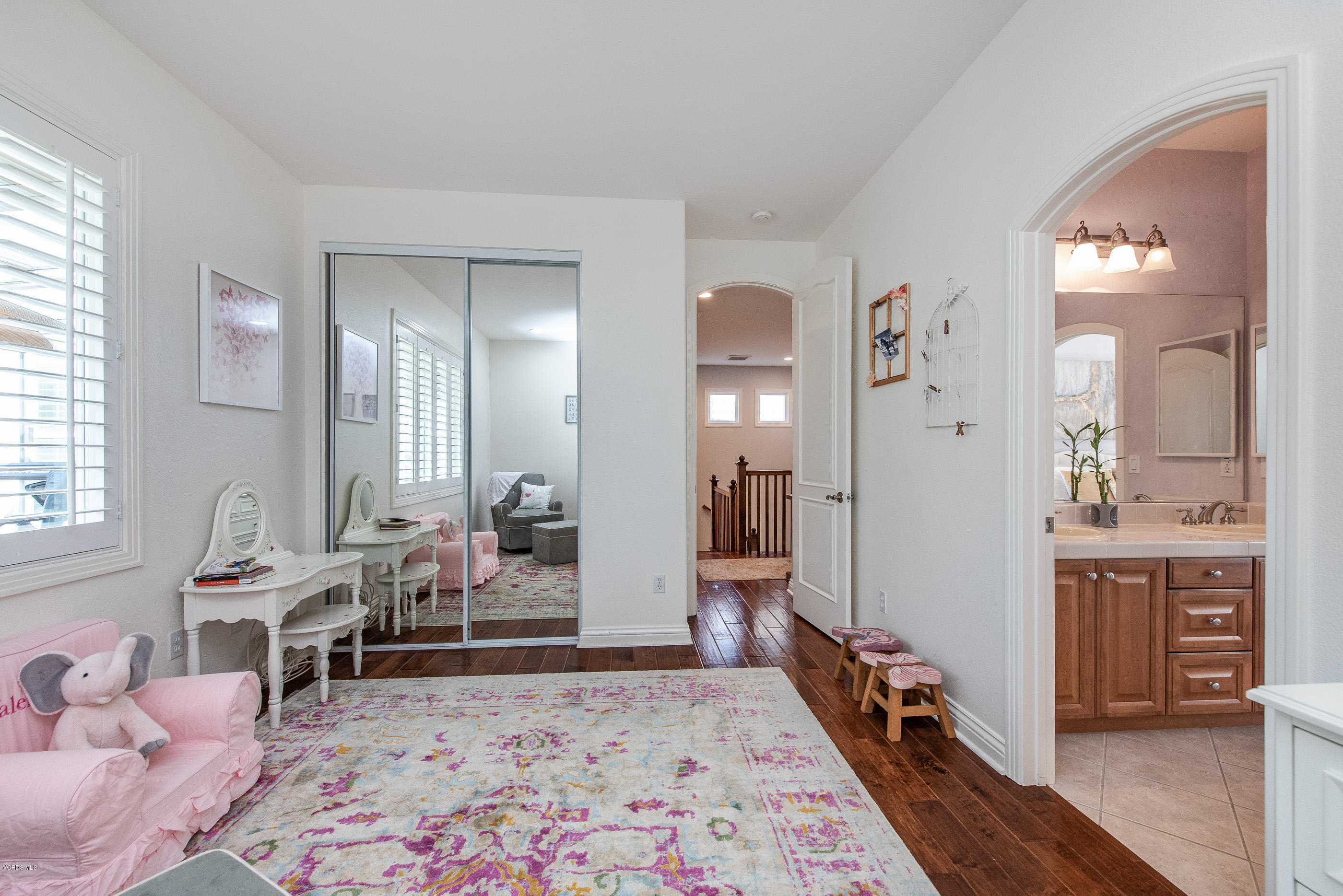 5635 Evening Sky Drive Simi Valley, CA 93063 - Photo 51 of 84 a bedroom with furniture and a wooden floor