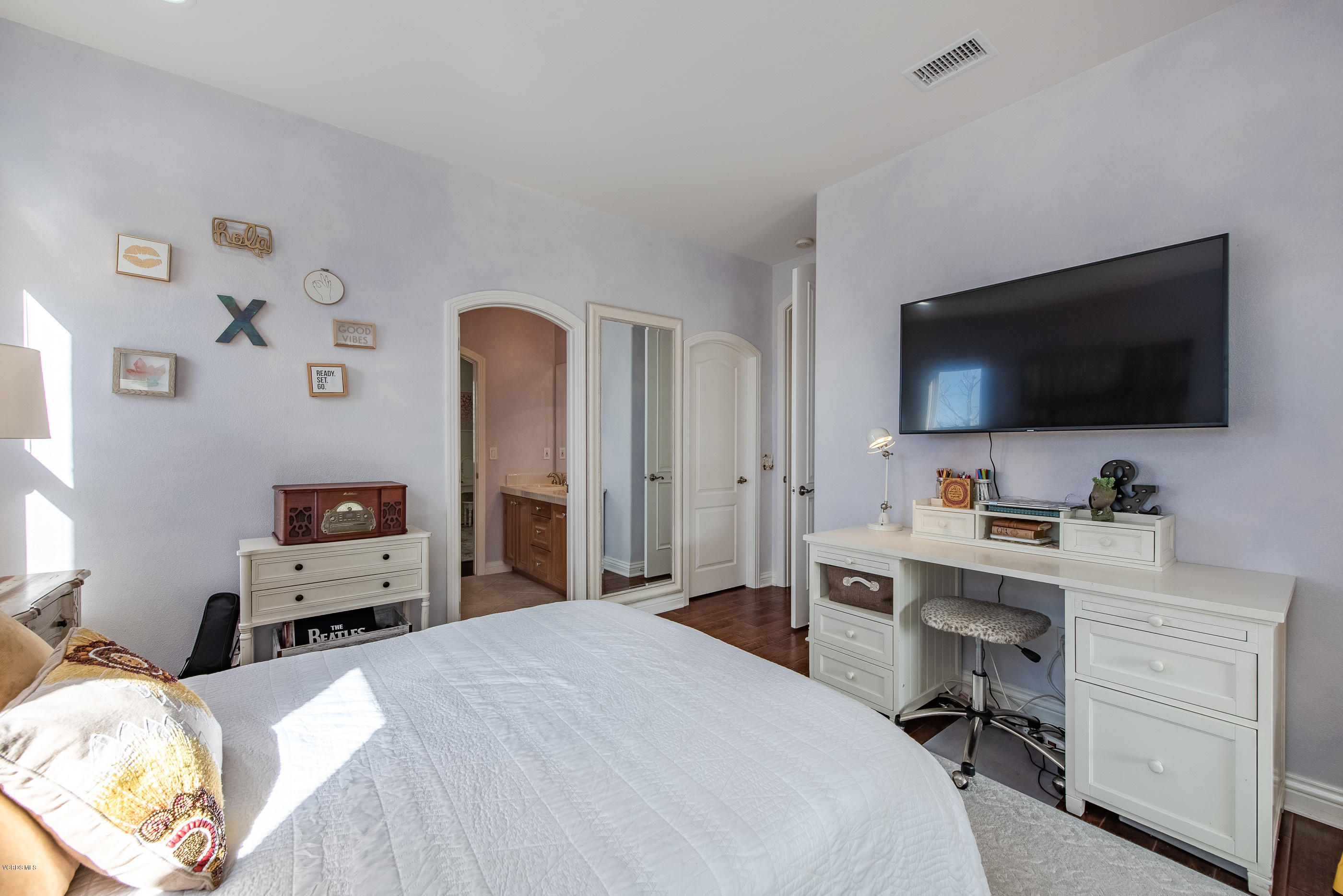 5635 Evening Sky Drive Simi Valley, CA 93063 - Photo 56 of 84 a bedroom with a bed and a flat screen tv