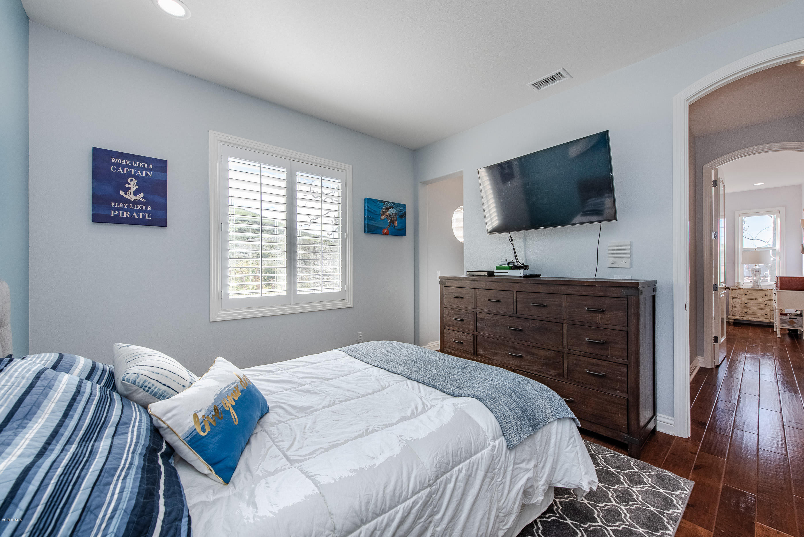 5635 Evening Sky Drive Simi Valley, CA 93063 - Photo 58 of 84 a bedroom with a bed and flat screen tv