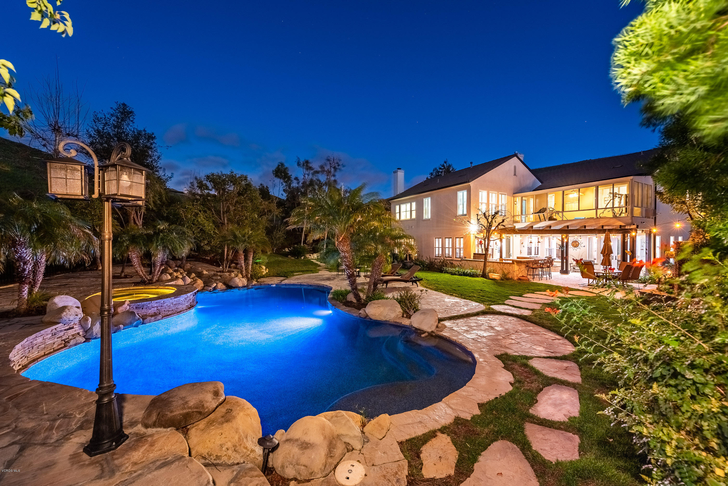 5635 Evening Sky Drive Simi Valley, CA 93063 - Photo 7 of 84 a view of a swimming pool with an outdoor space and seating area