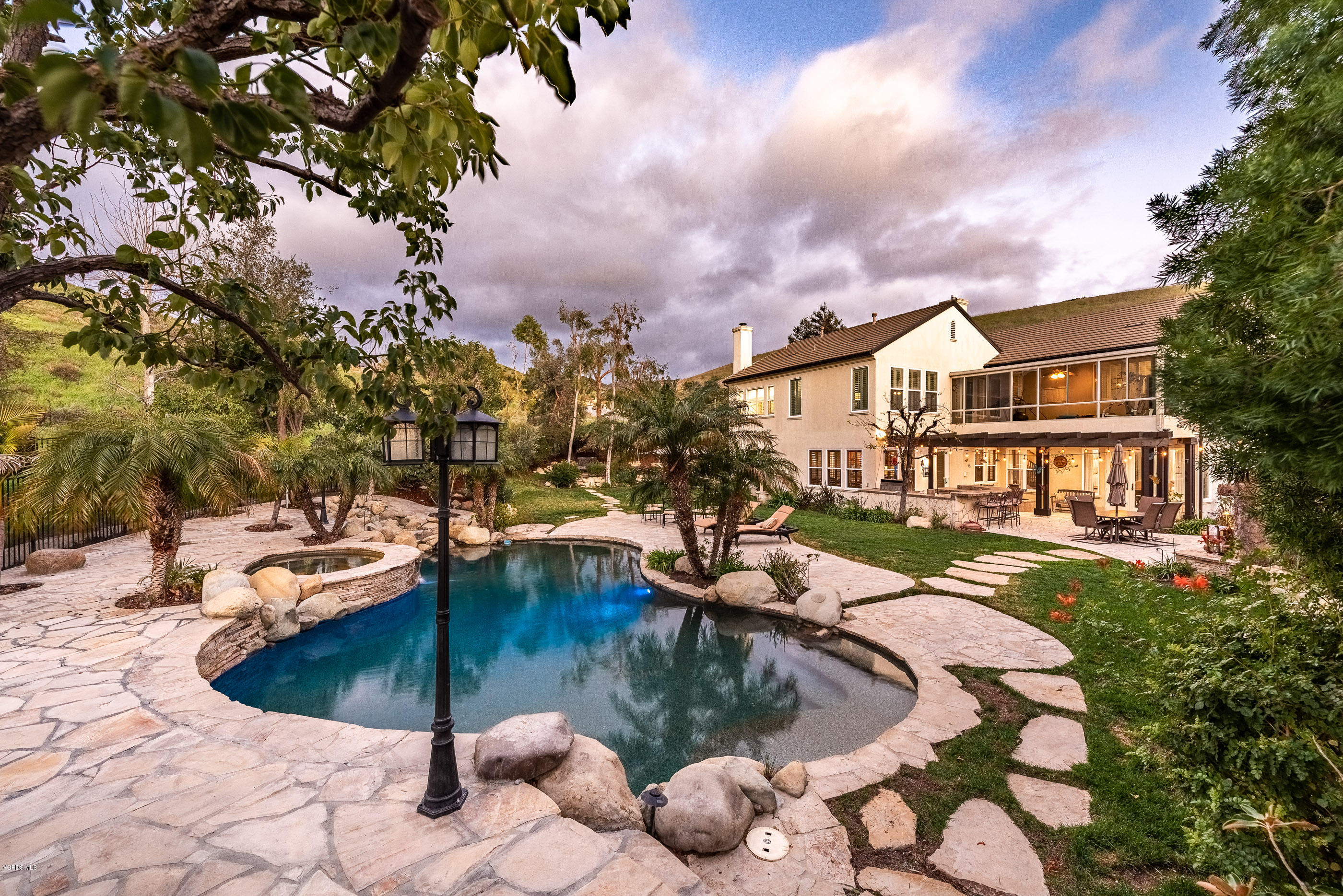 5635 Evening Sky Drive Simi Valley, CA 93063 - Photo 71 of 84 a view of a swimming pool with a patio