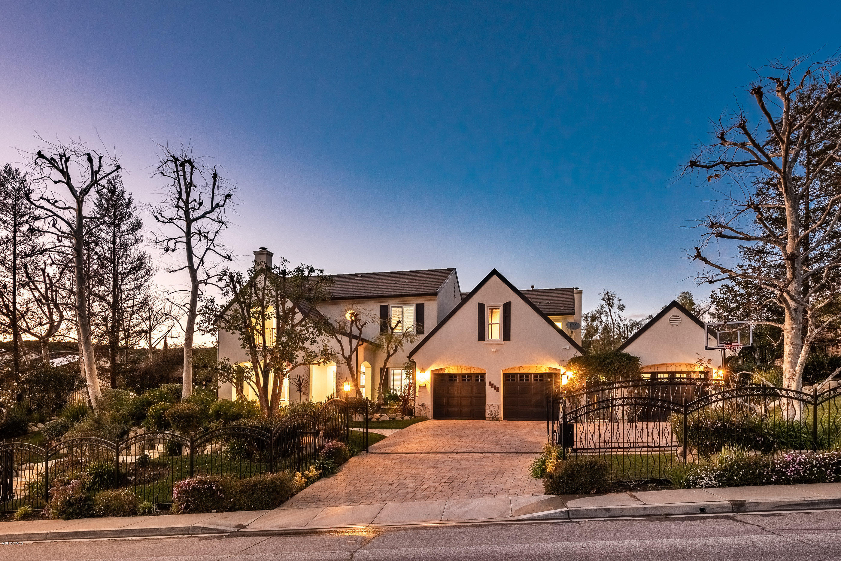 5635 Evening Sky Drive Simi Valley, CA 93063 - Photo 78 of 84 a front view of a house with a yard and garage