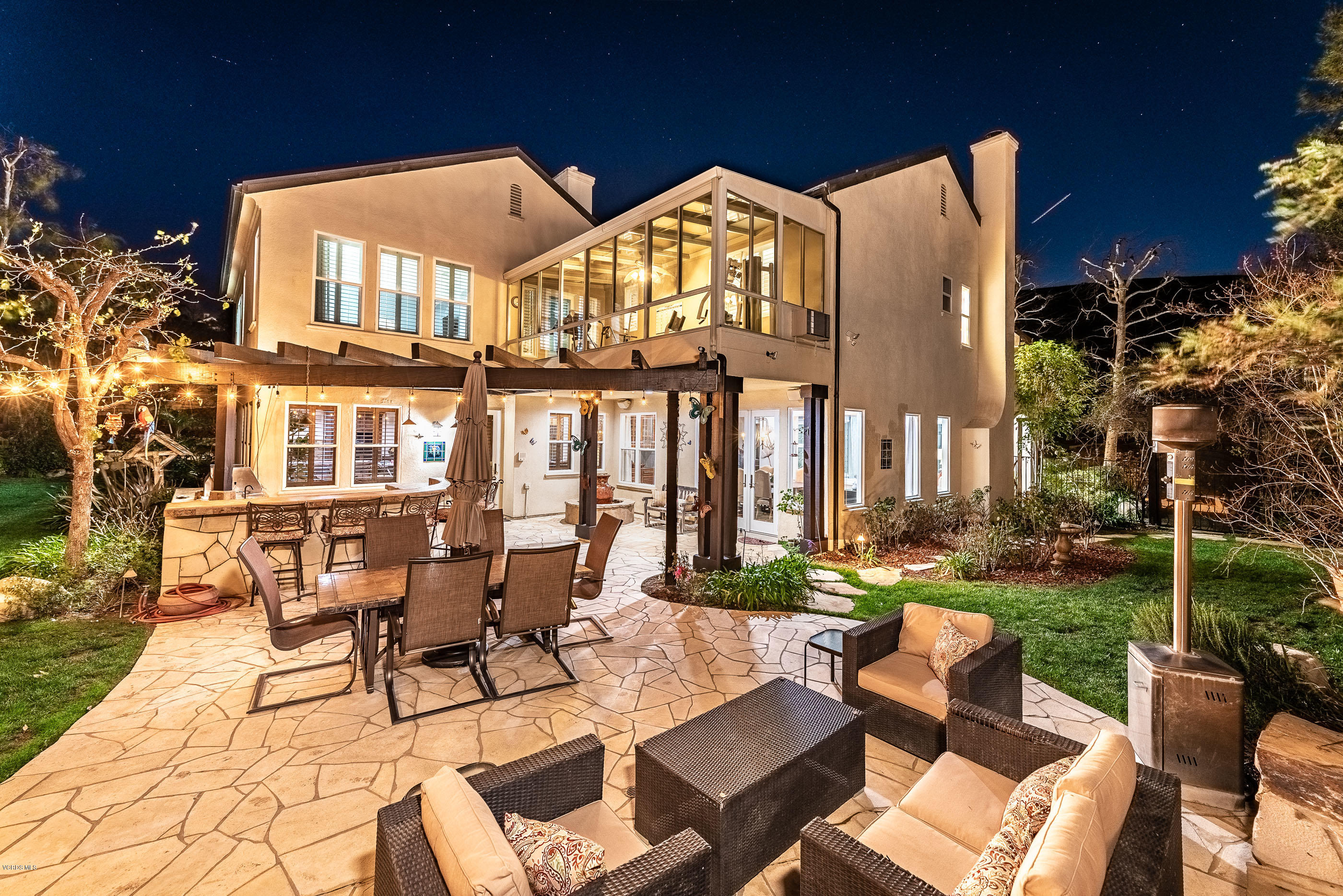 5635 Evening Sky Drive Simi Valley, CA 93063 - Photo 82 of 84 a view of a patio with couches table and chairs and potted plants