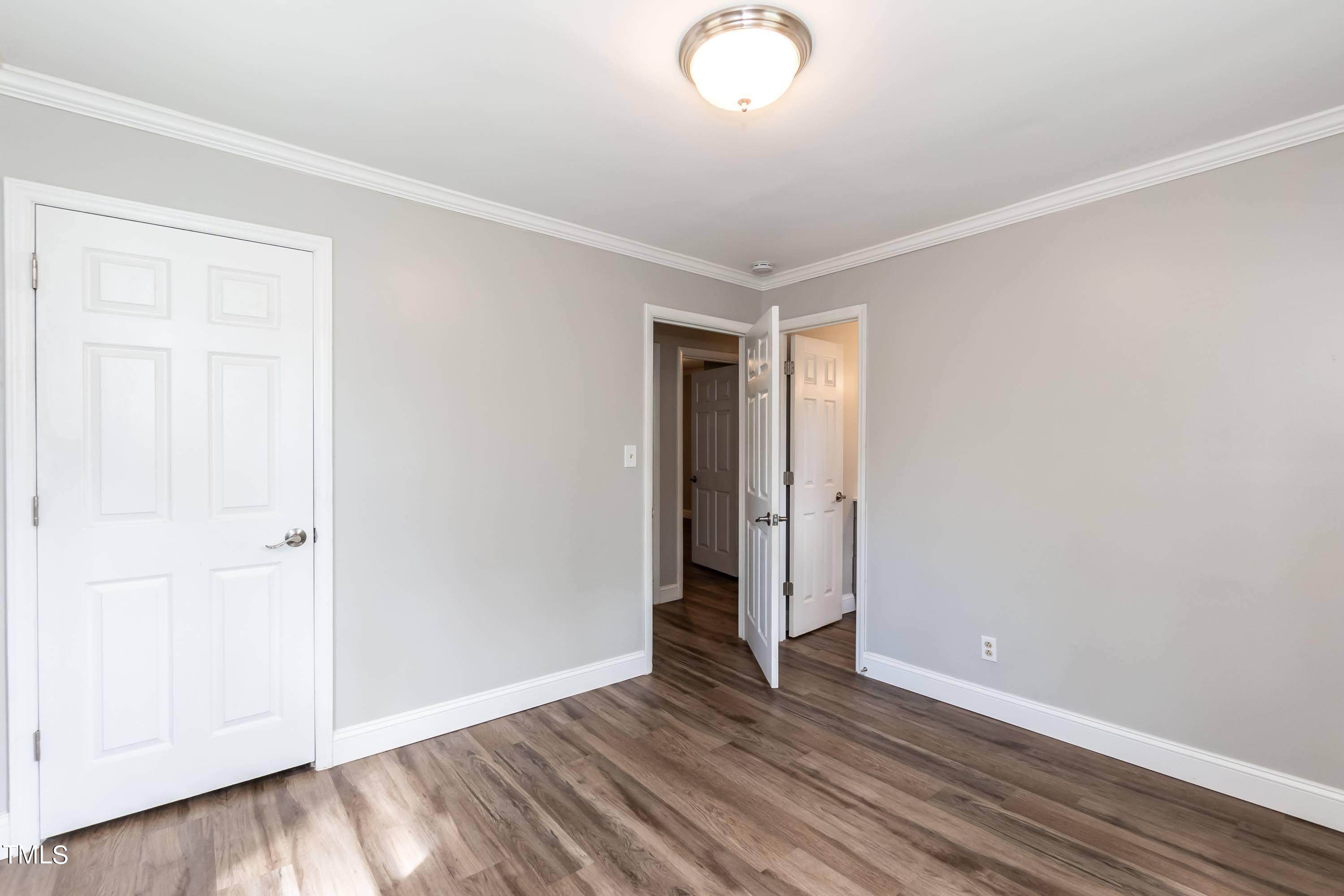 2019 Highway 55 Durham, NC 27707 - Photo 13 of 34 an empty room with wooden floor and closet