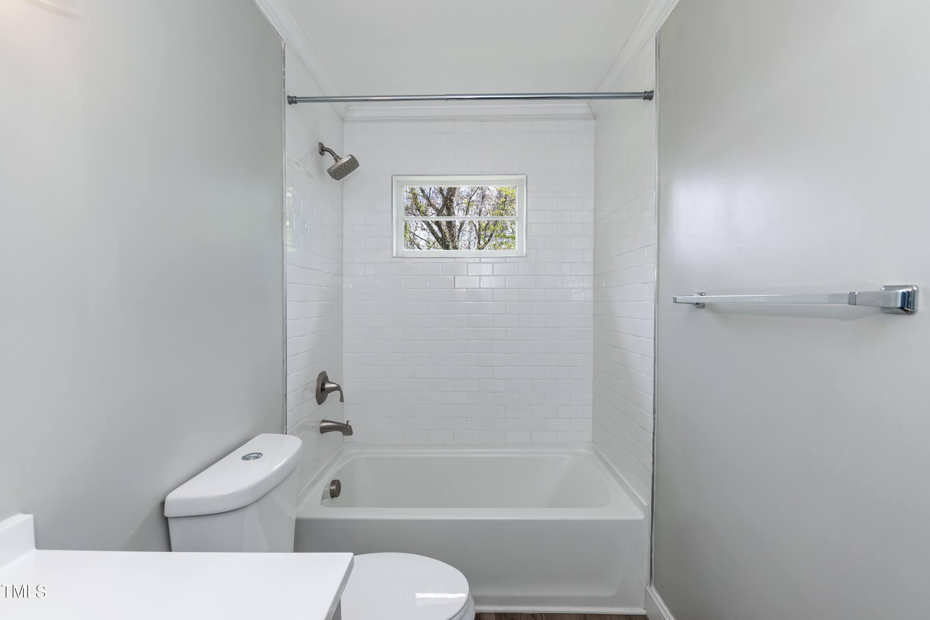 2019 Highway 55 Durham, NC 27707 - Photo 15 of 34 a bathroom with a toilet a sink and bathtub