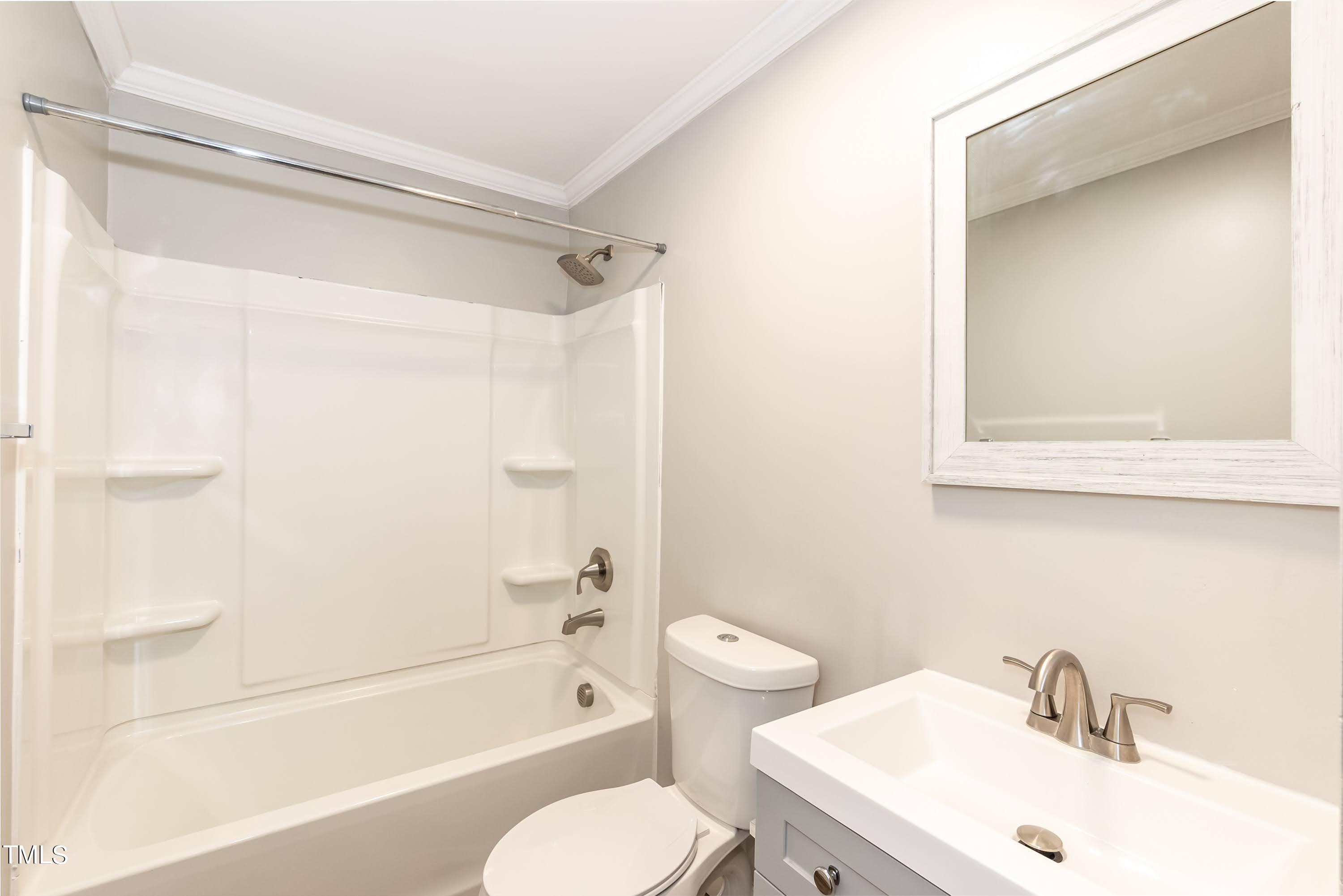 2019 Highway 55 Durham, NC 27707 - Photo 18 of 34 a bathroom with a sink toilet and shower