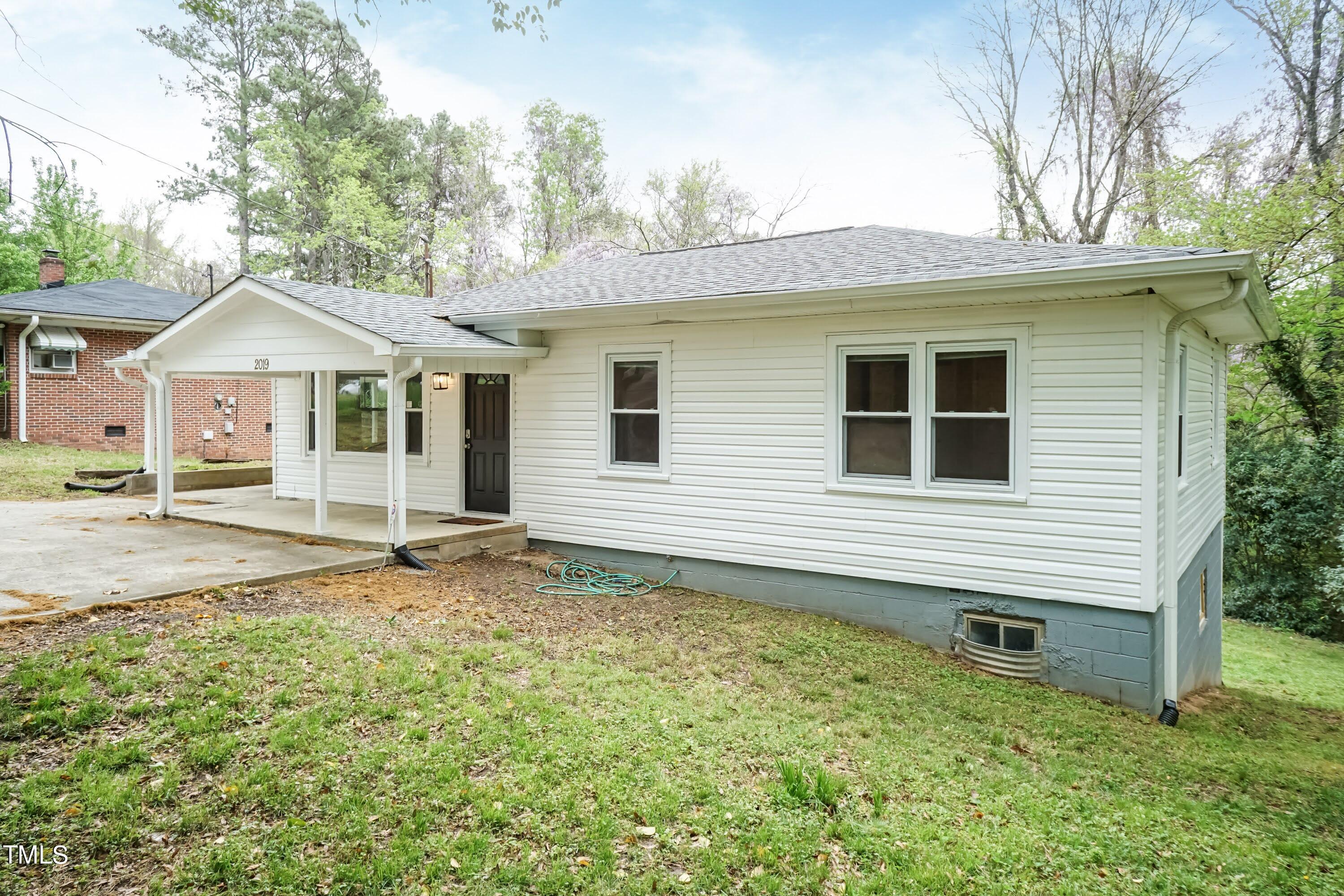 2019 Highway 55 Durham, NC 27707 - Photo 20 of 34 a backyard of a house with table and chairs