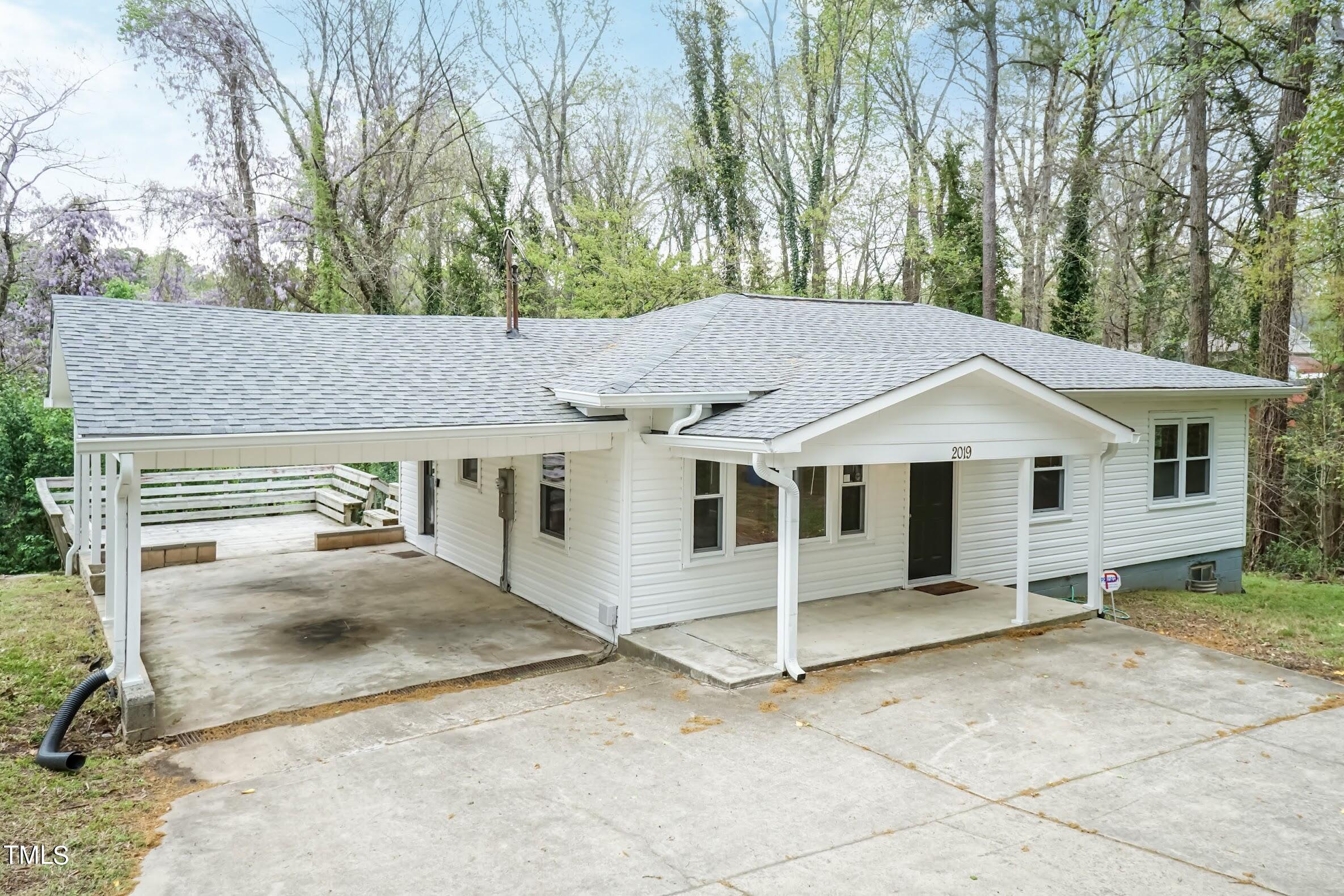 2019 Highway 55 Durham, NC 27707 - Photo 22 of 34 a house with trees in the background