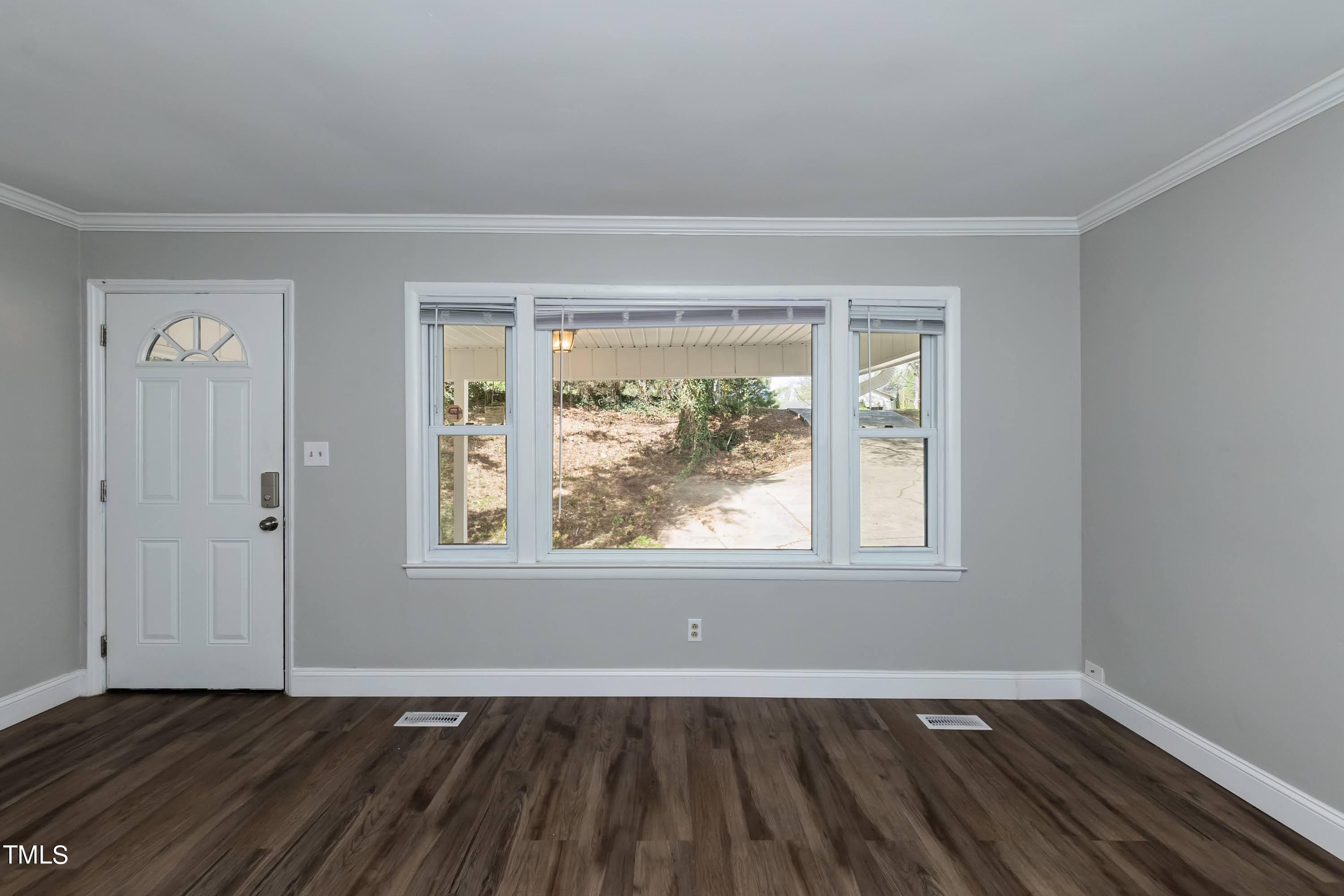 2019 Highway 55 Durham, NC 27707 - Photo 3 of 34 an empty room with wooden floor and windows