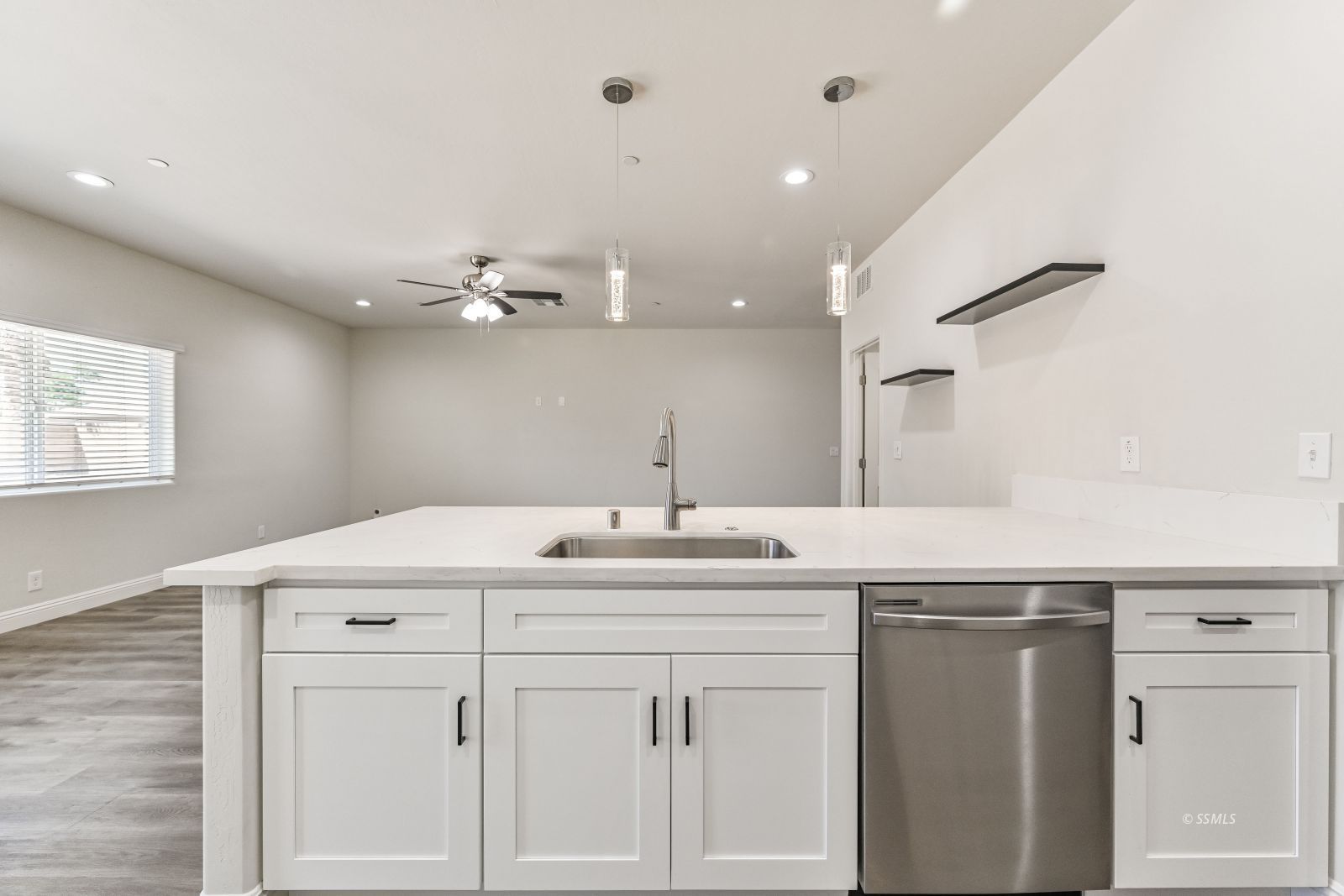 1031 West Church Avenue Ridgecrest, CA 93555 - Photo 10 of 49 a kitchen with a sink vanity and a mirror