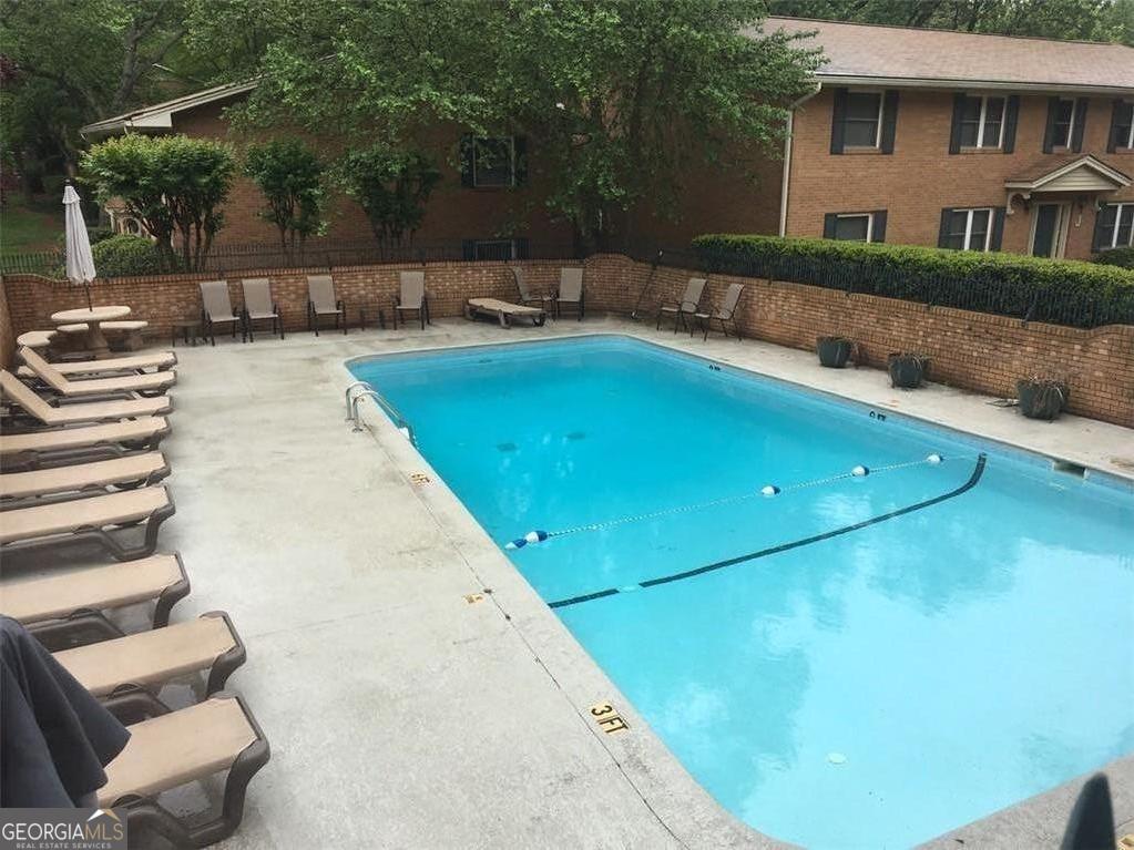3510 Roswell Road, Unit H1 Atlanta, GA 30326 - Photo 10 of 43 a view of a house with swimming pool