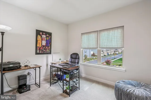 a work room with furniture and a window