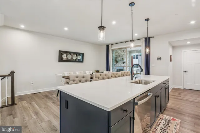 a view of a kitchen counter space a sink and appliances