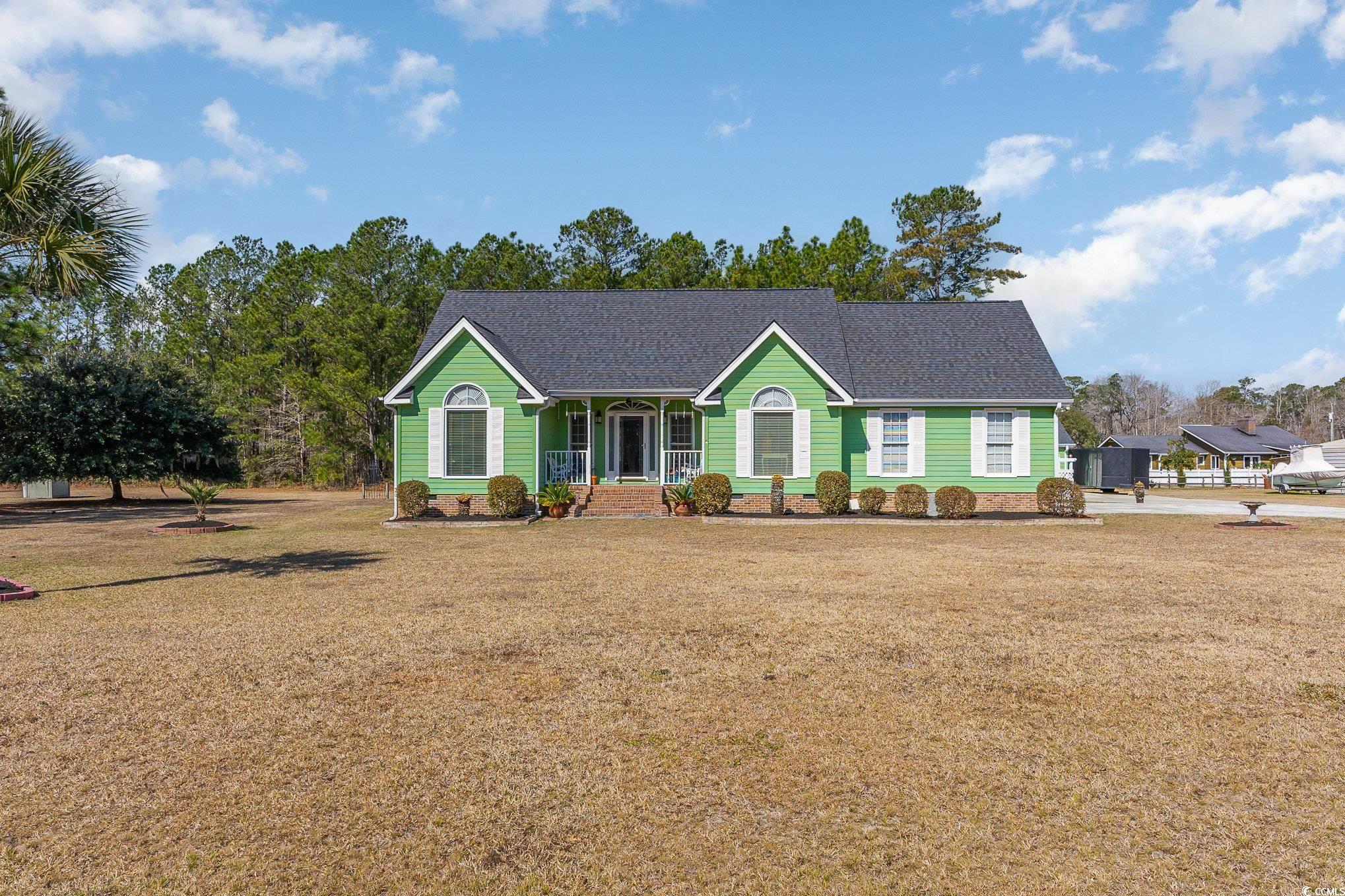 354 Deer Run Avenue Georgetown, SC 29440 - Photo 1 of 32 Ranch-style home featuring a porch, a front yard,