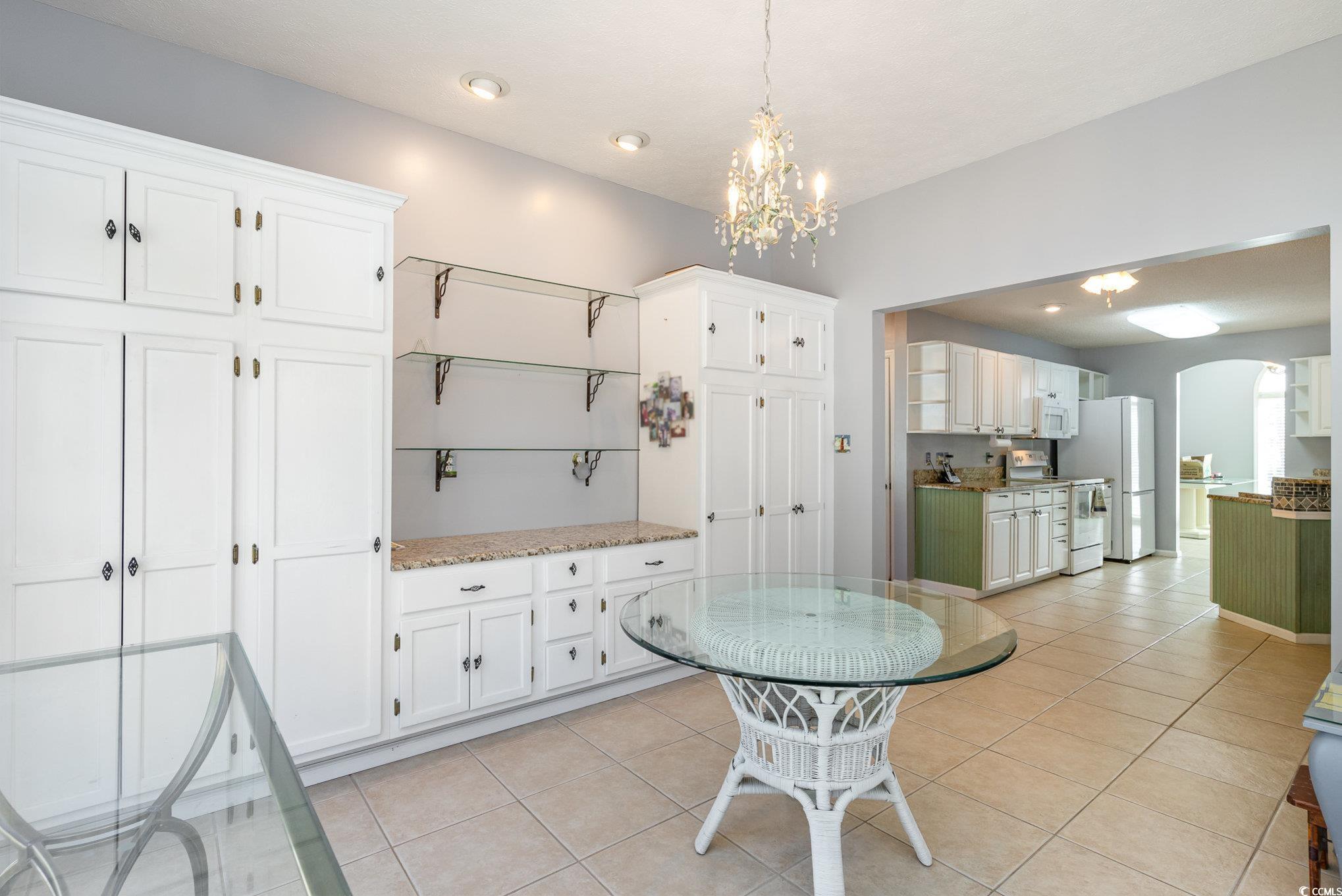 354 Deer Run Avenue Georgetown, SC 29440 - Photo 11 of 32 Eat in kitchen featuring arched walkways, light ti