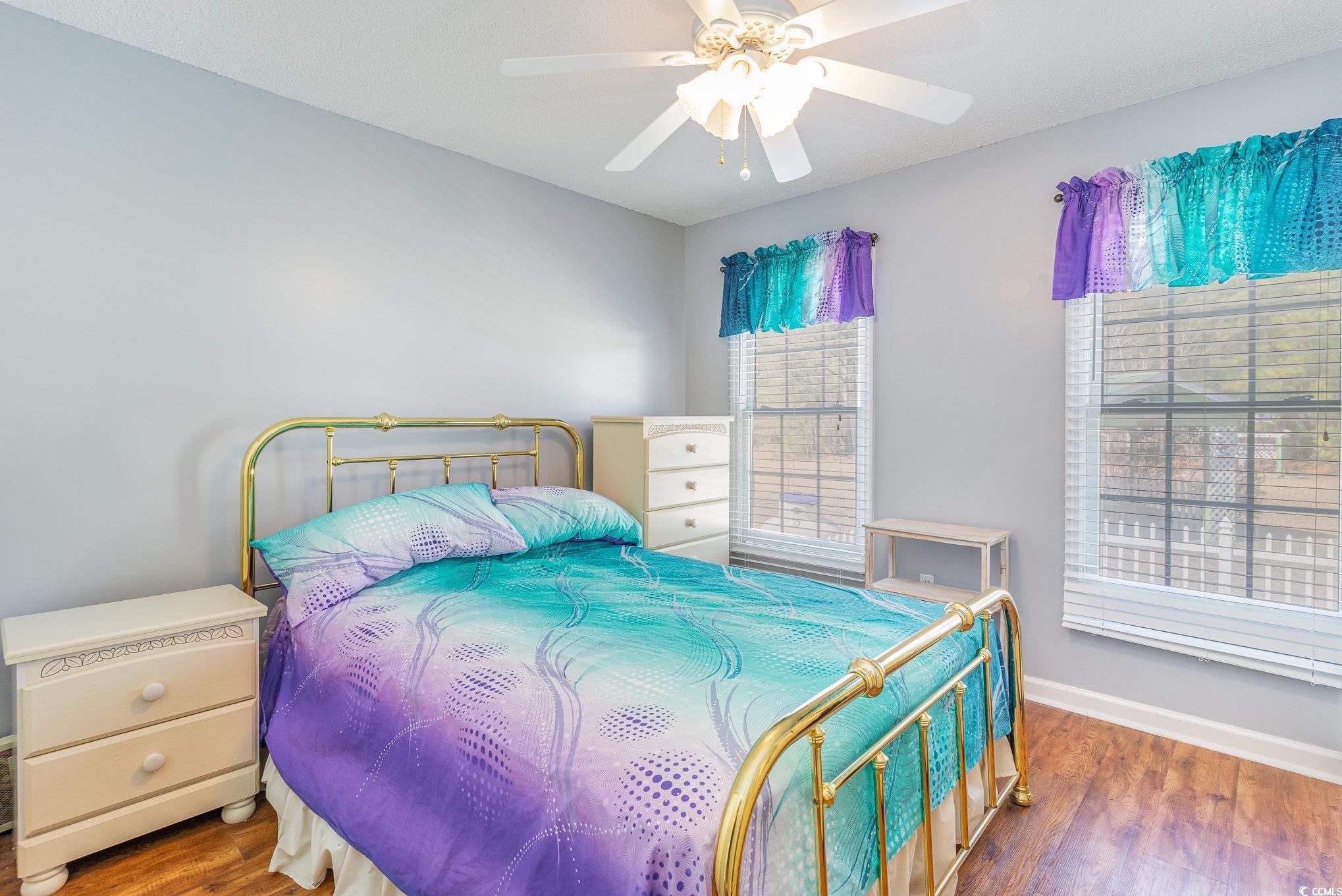 354 Deer Run Avenue Georgetown, SC 29440 - Photo 17 of 32 Bedroom with baseboards, a ceiling fan, and wood f