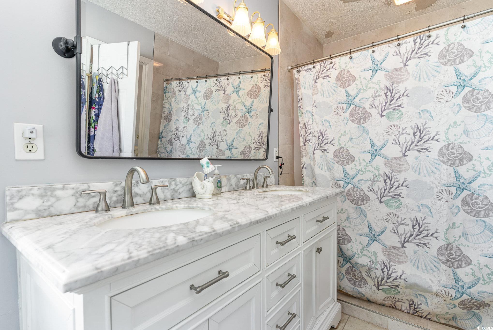 354 Deer Run Avenue Georgetown, SC 29440 - Photo 20 of 32 Full bathroom with a textured ceiling, double vani