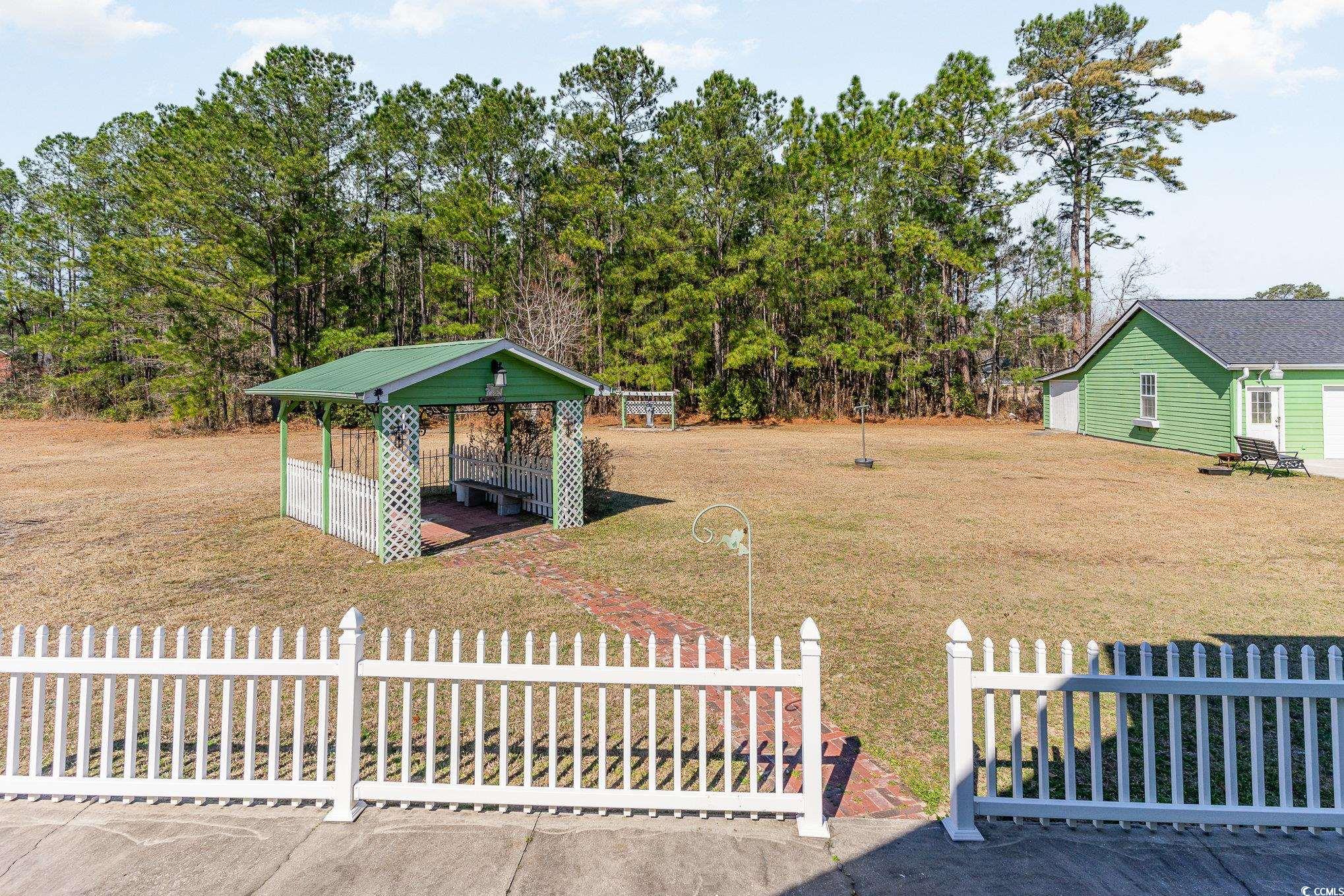 354 Deer Run Avenue Georgetown, SC 29440 - Photo 25 of 32 View of yard featuring a gazebo and fence