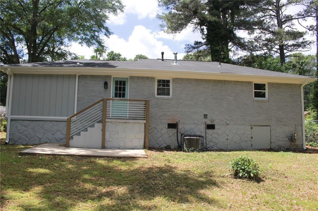 2130 Seavey Drive Decatur, GA 30032 - Photo 16 of 16 a view of a house with a yard and garage
