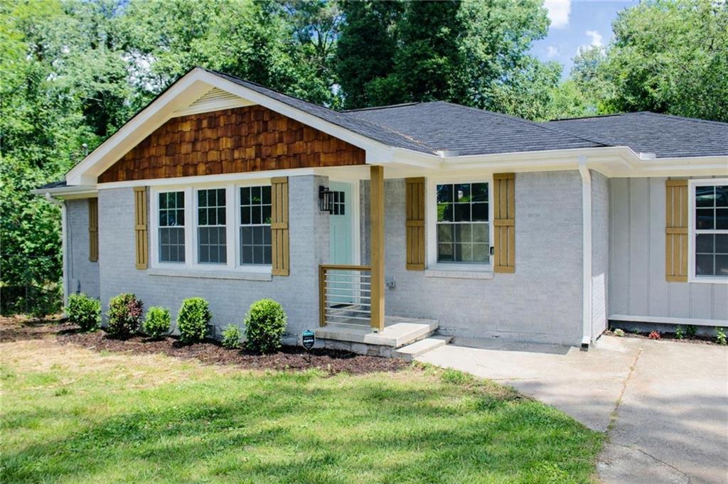 2130 Seavey Drive Decatur, GA 30032 - Photo 2 of 16 a front view of a house with a yard