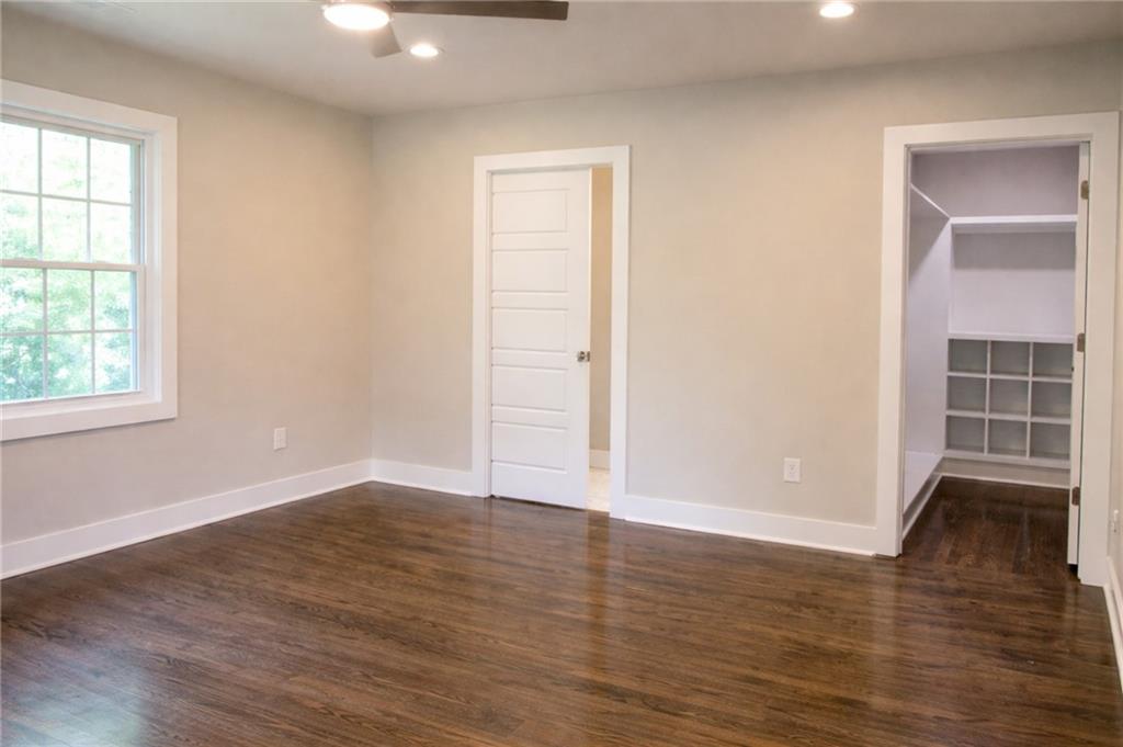 2130 Seavey Drive Decatur, GA 30032 - Photo 9 of 16 an empty room with wooden floor and windows