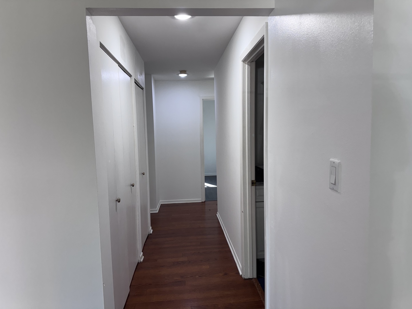 1785 West Algonquin Road, Unit 2A Mount Prospect, IL 60056 - Photo 8 of 14 a view of a hallway with the wooden floor