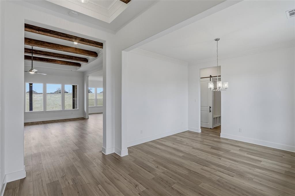 808 Vly Rdg Road Van Alstyne, TX 75495 - Photo 6 of 39 a view of empty room with wooden floor and fan