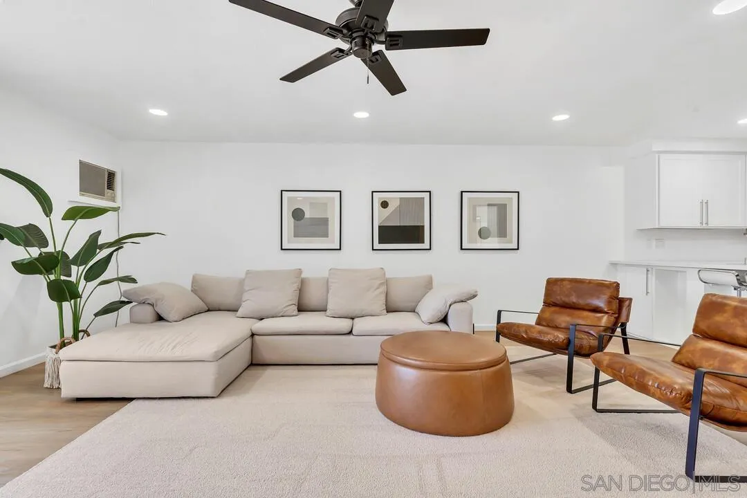 12027 Royal Road, Unit 3 El Cajon, CA 92021 - Photo 1 of 30 a living room with furniture and a potted plant