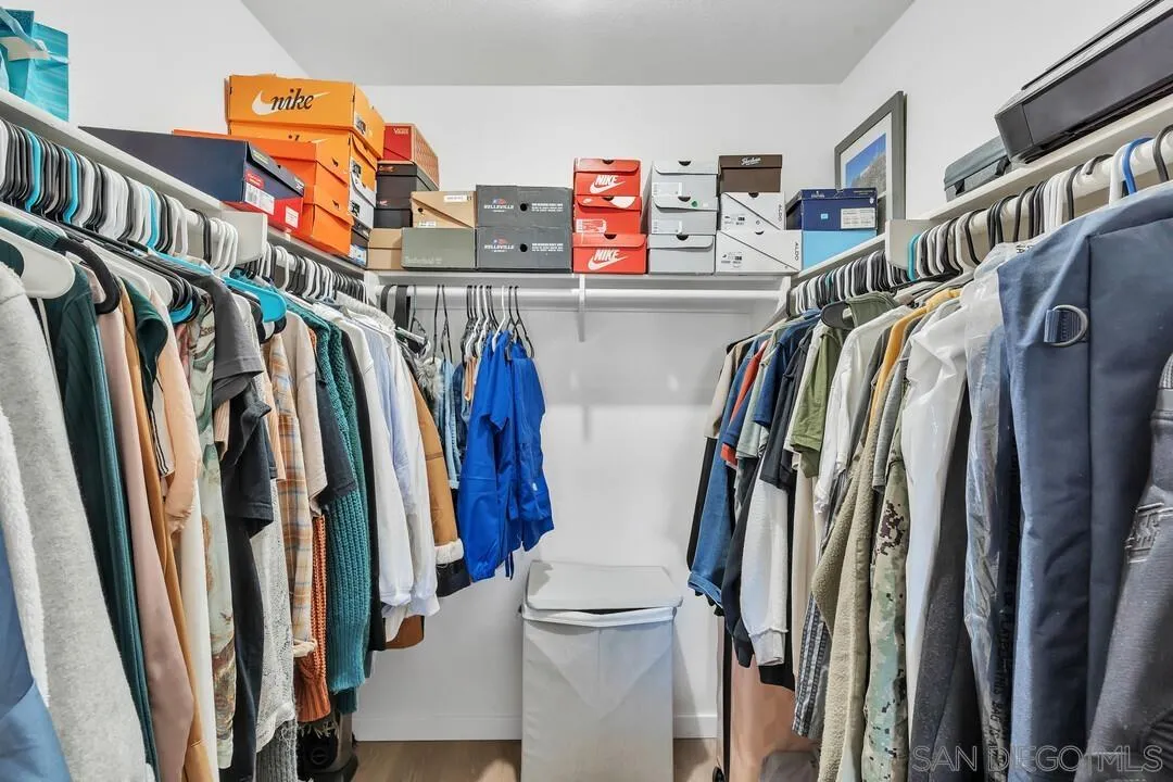 12027 Royal Road, Unit 3 El Cajon, CA 92021 - Photo 17 of 30 a view of walk in closet with clothes and shoes