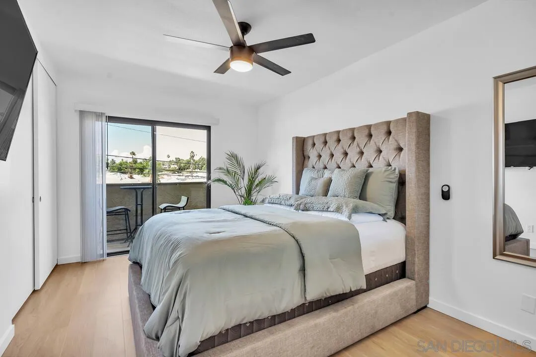 12027 Royal Road, Unit 3 El Cajon, CA 92021 - Photo 20 of 30 a bedroom with a large bed and a window