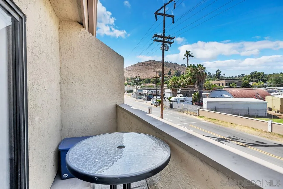 12027 Royal Road, Unit 3 El Cajon, CA 92021 - Photo 22 of 30 a view of a living room and chandelier