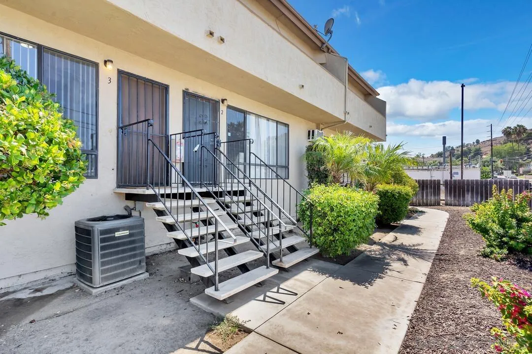 12027 Royal Road, Unit 3 El Cajon, CA 92021 - Photo 26 of 30 a front view of a house with garden