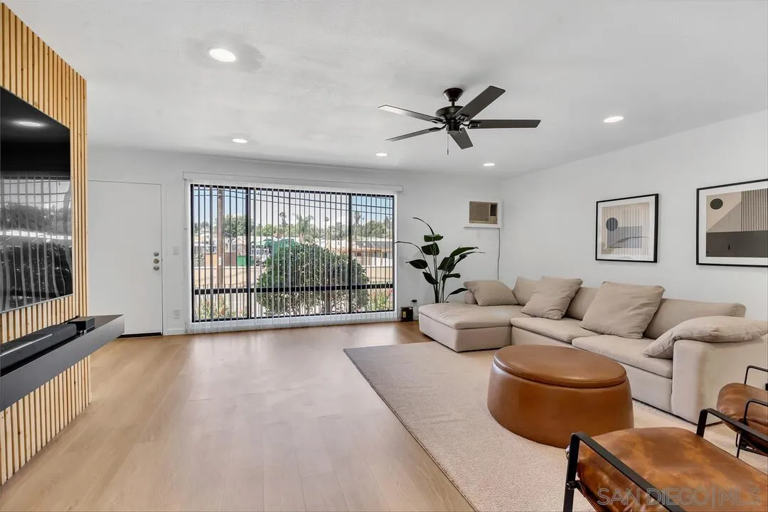 12027 Royal Road, Unit 3 El Cajon, CA 92021 - Photo 4 of 30 a living room with furniture and a flat screen tv