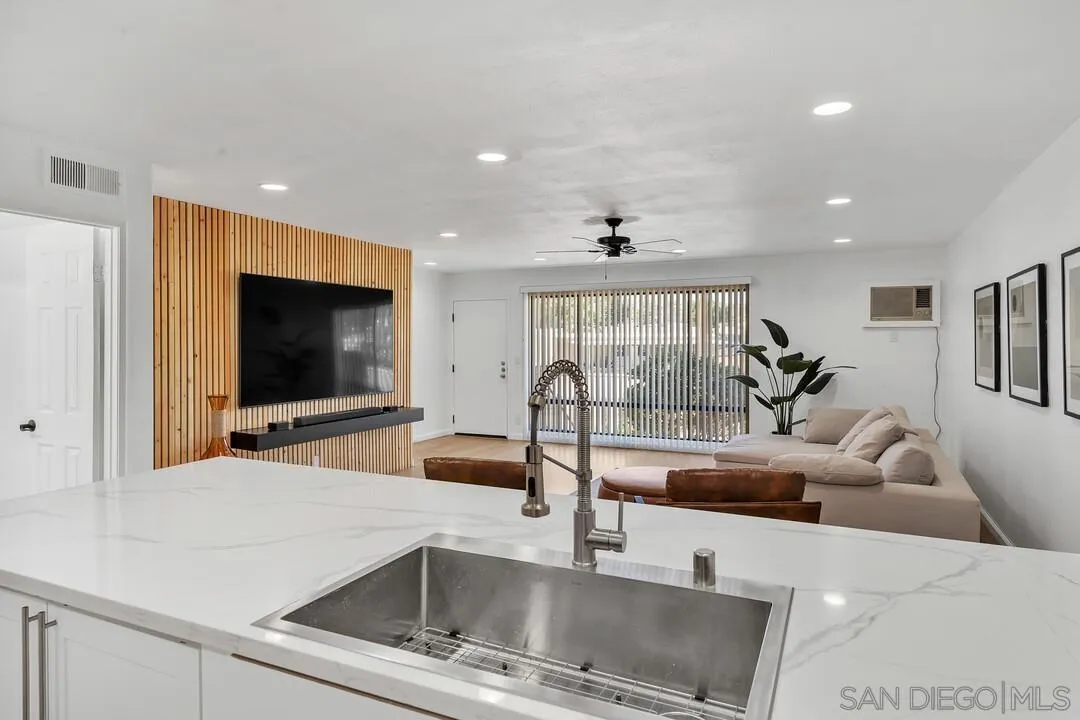 12027 Royal Road, Unit 3 El Cajon, CA 92021 - Photo 8 of 30 a living room with furniture and a flat screen tv