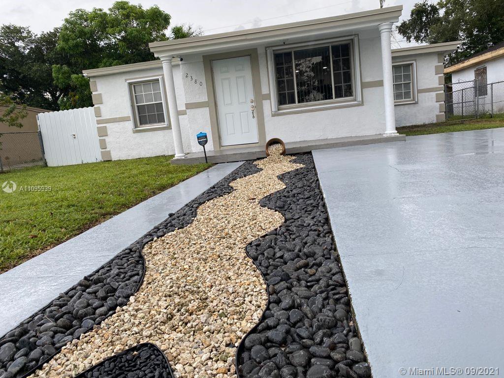 2380 Service Road Opa-Locka, FL 33054 - Photo 3 of 22 a view of a back yard of the house