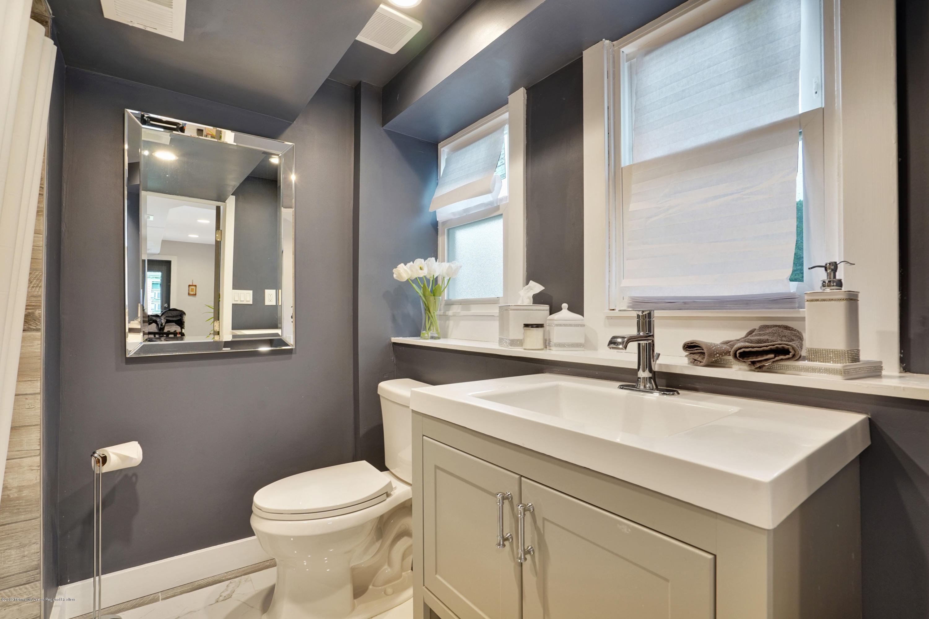 5 Ash Street Eatontown, NJ 07724 - Photo 16 of 31 a bathroom with a sink toilet and mirror
