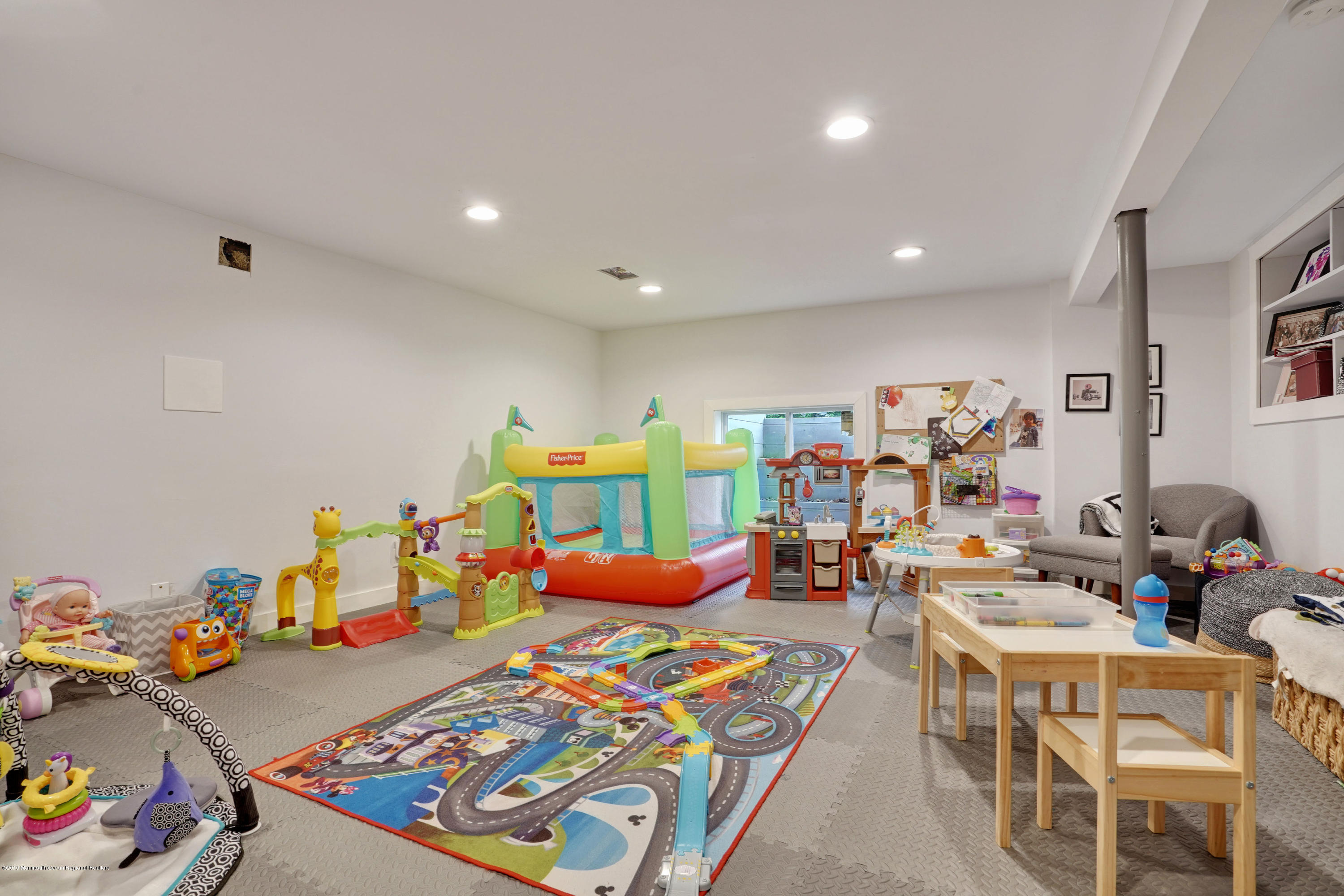 5 Ash Street Eatontown, NJ 07724 - Photo 20 of 31 a playing room with furniture and a wooden floor