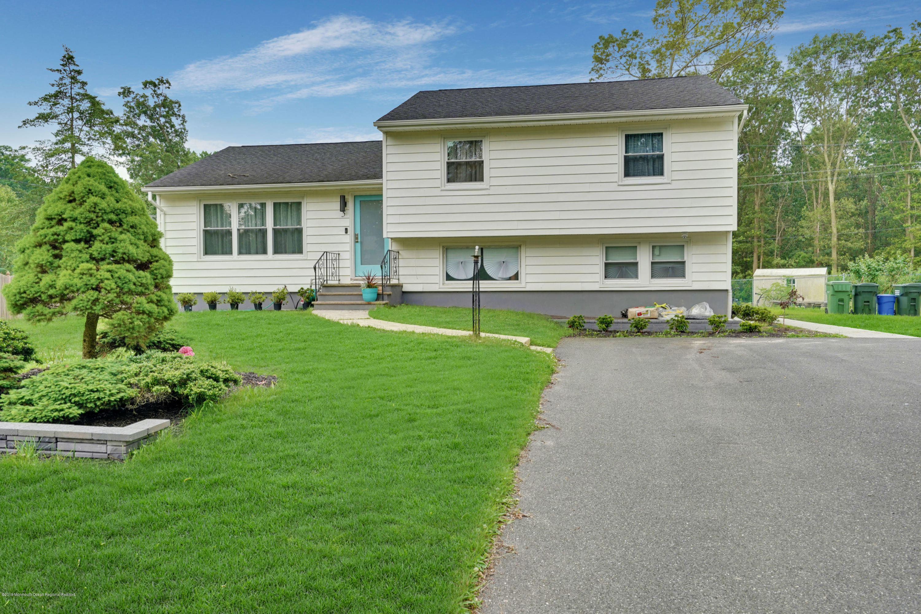 5 Ash Street Eatontown, NJ 07724 - Photo 22 of 31 a front view of house with yard and green space
