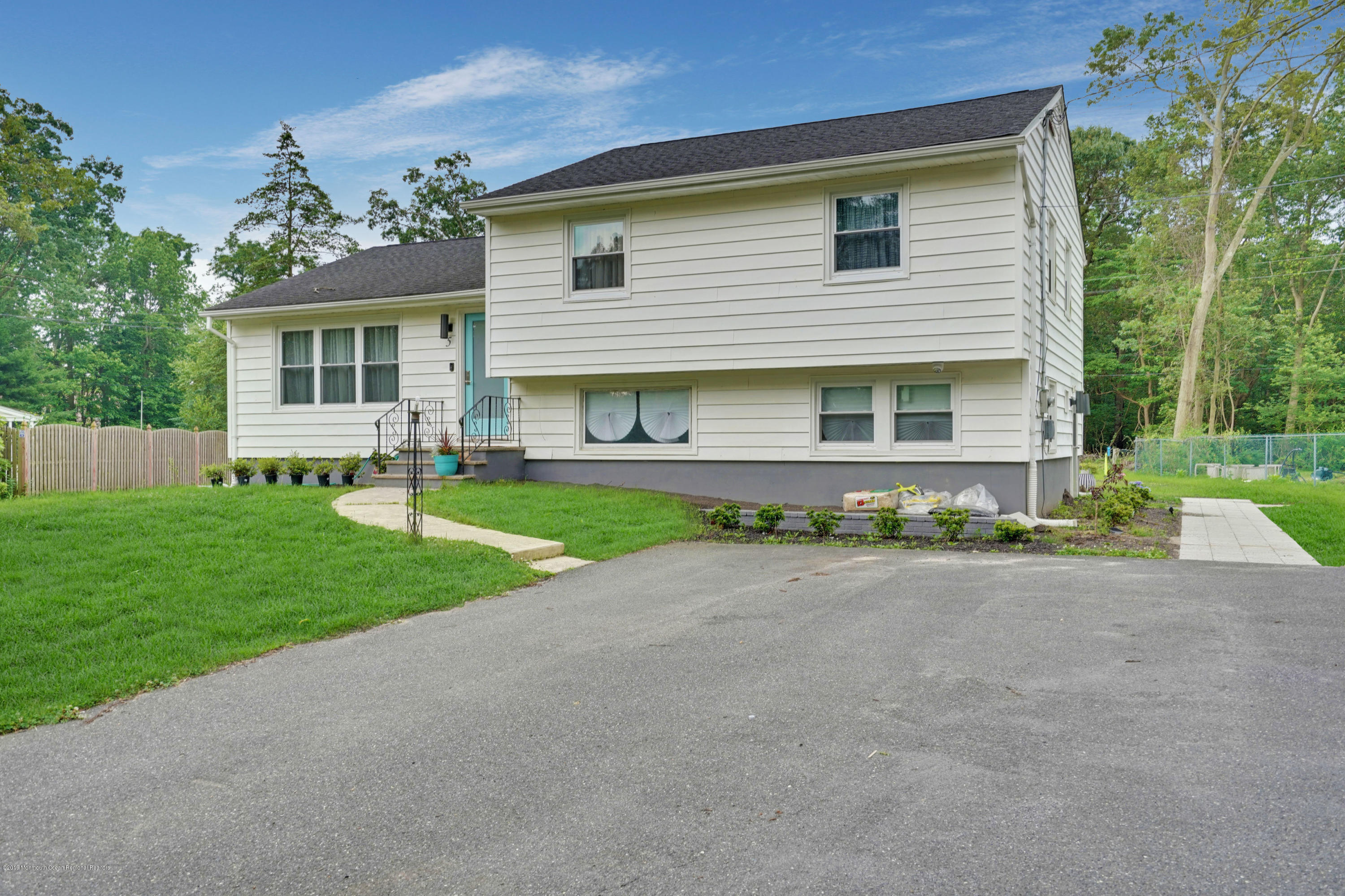 5 Ash Street Eatontown, NJ 07724 - Photo 23 of 31 a front view of house with yard and green space