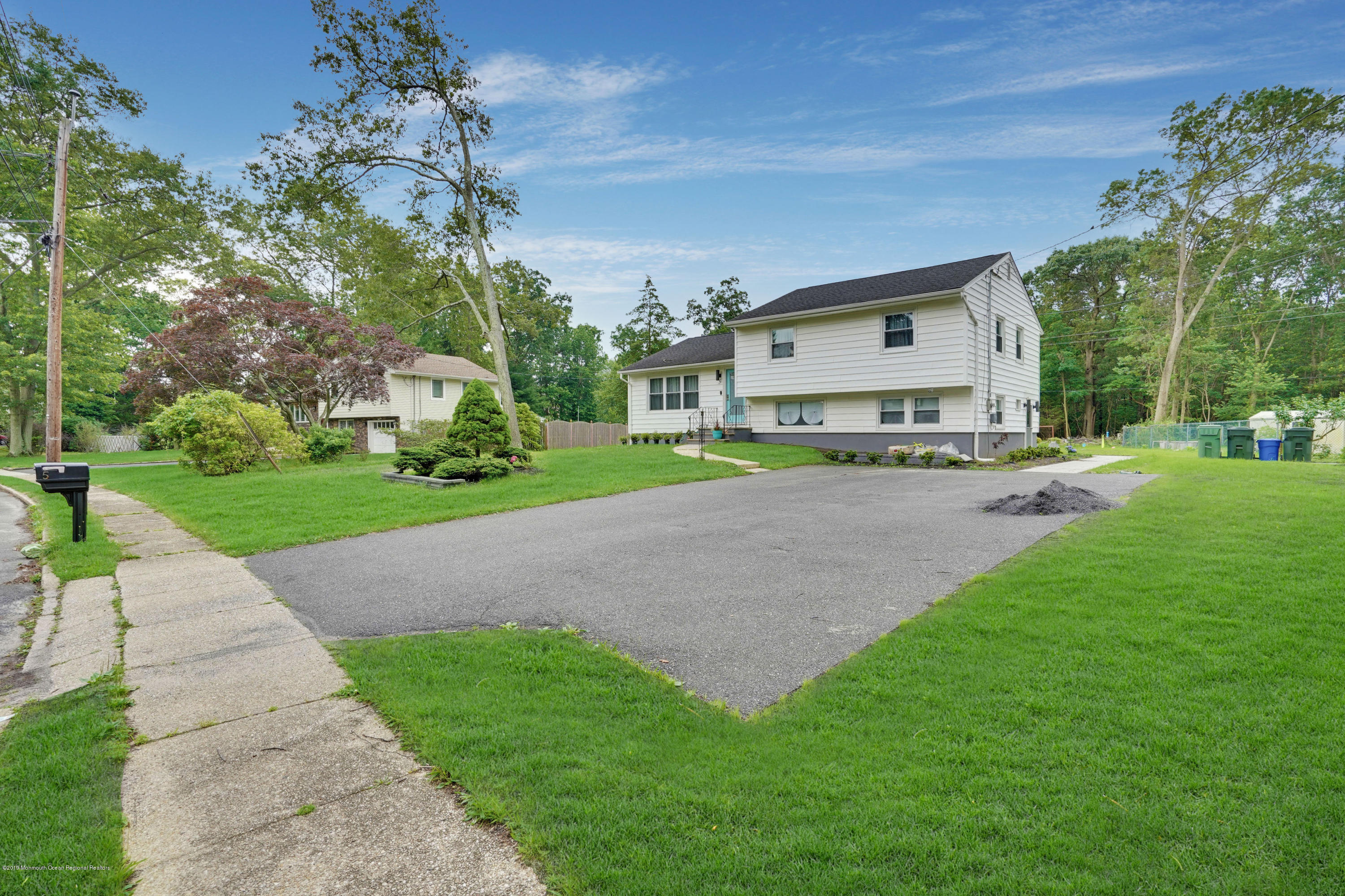 5 Ash Street Eatontown, NJ 07724 - Photo 24 of 31 a view of a house with a yard and sitting area