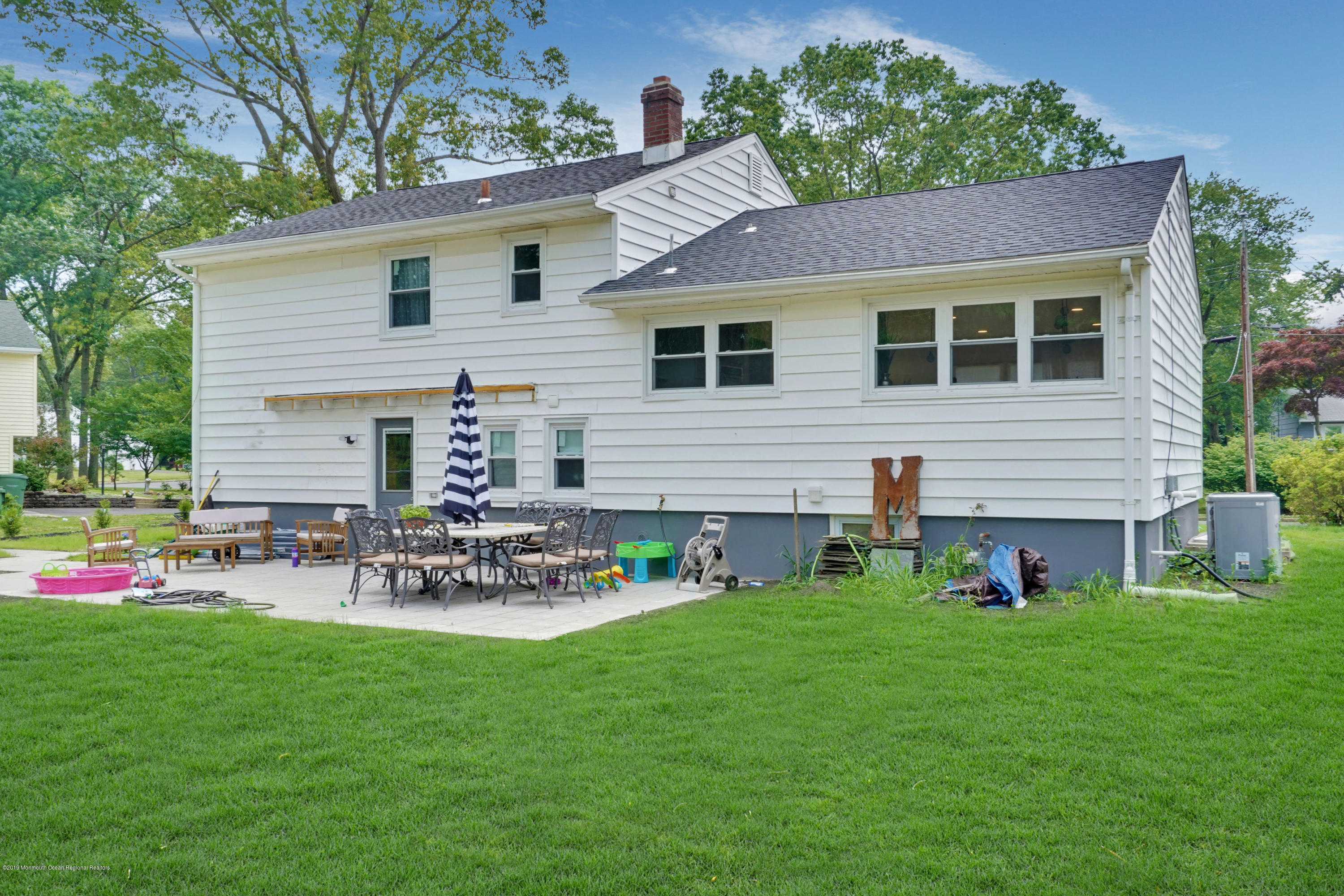 5 Ash Street Eatontown, NJ 07724 - Photo 28 of 31 a view of an house with backyard and sitting area