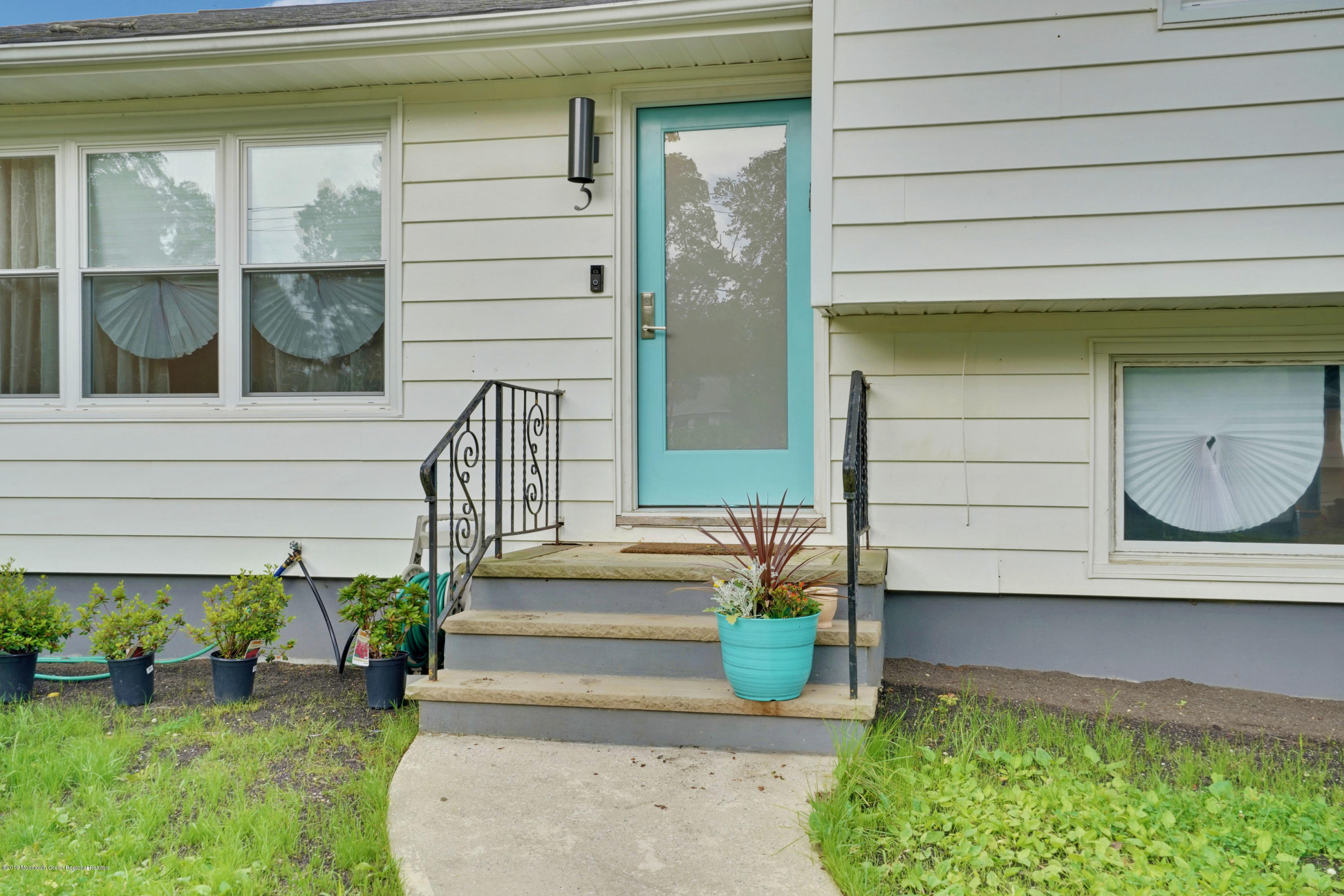 5 Ash Street Eatontown, NJ 07724 - Photo 29 of 31 a front view of a house with a garden