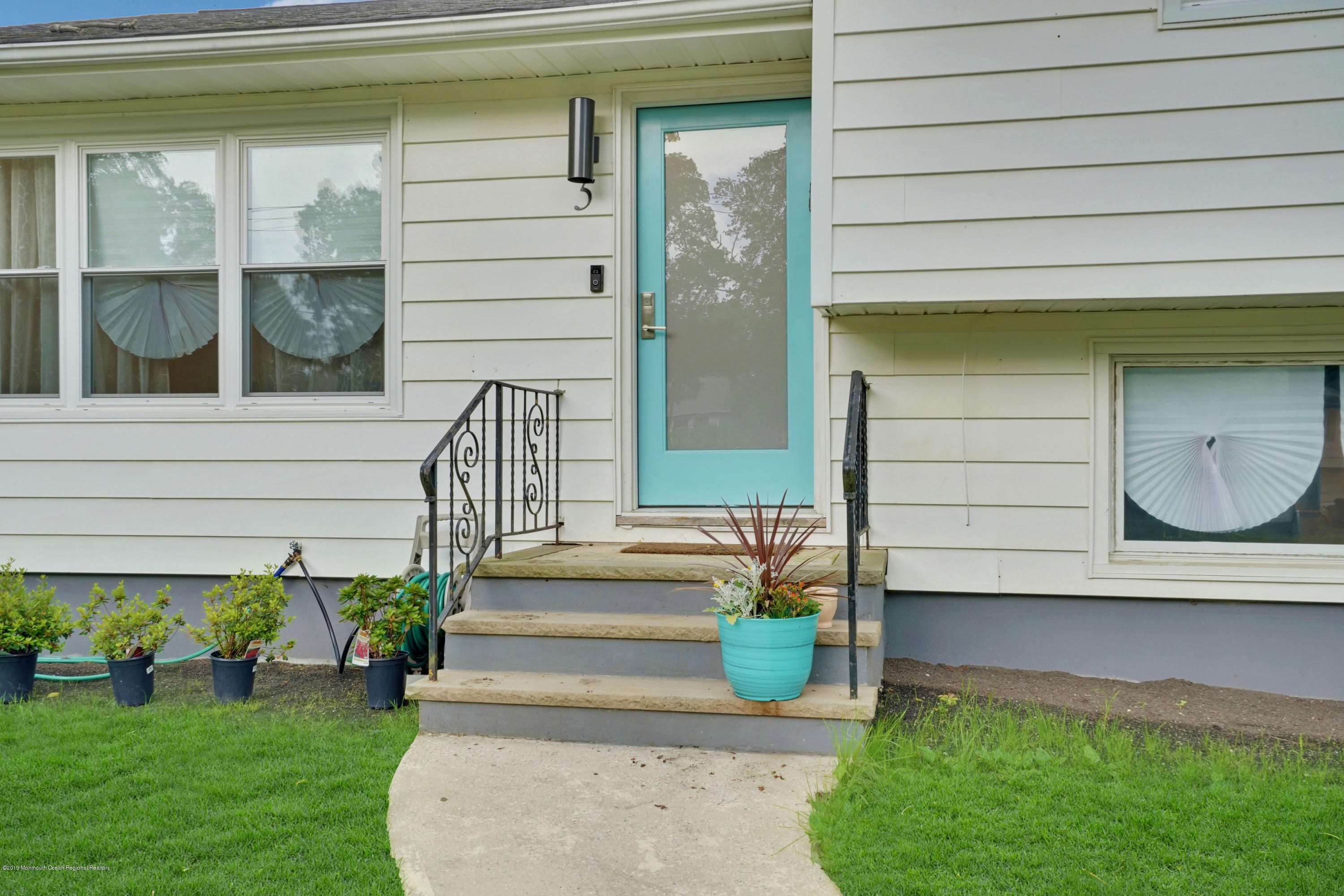 5 Ash Street Eatontown, NJ 07724 - Photo 30 of 31 a front view of a house with a garden